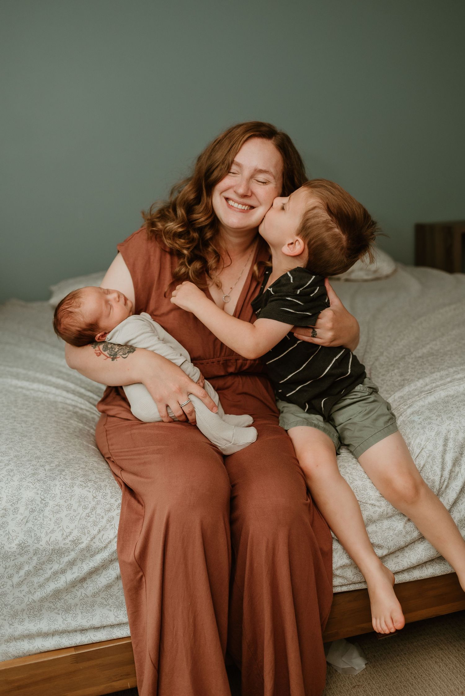 Joyful family moments captured in sequence on a bed, showing affectionate play and laughter against a green wall.