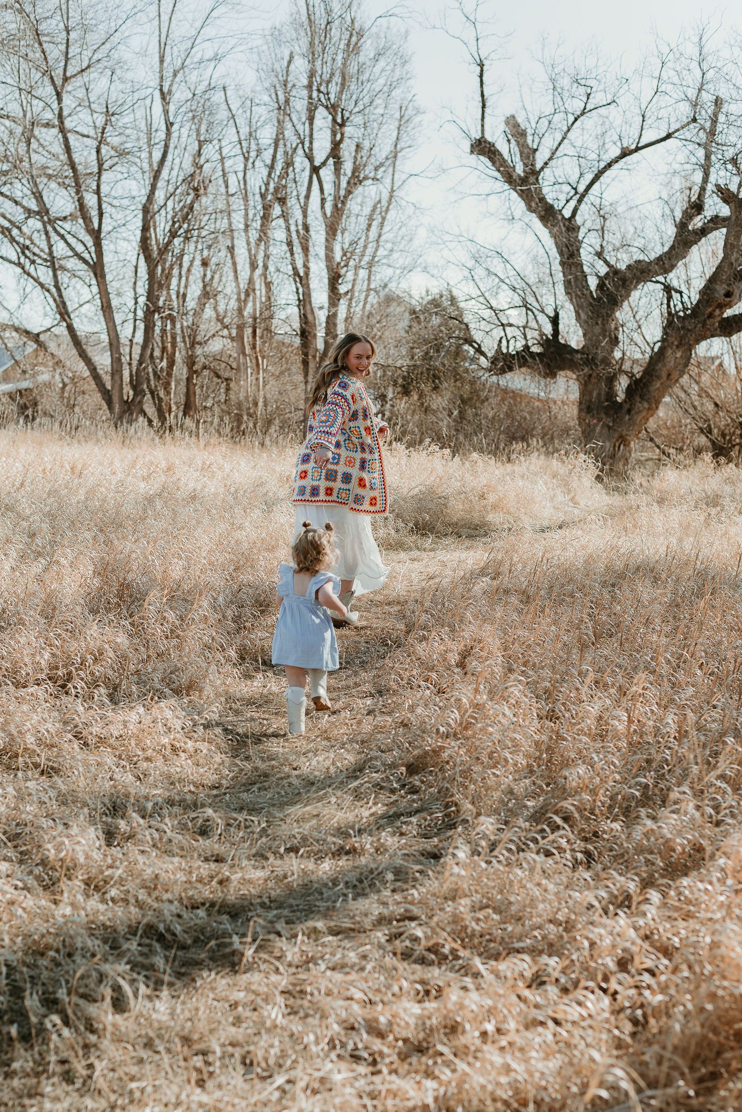 Candid moments captured in a rustic field setting with autumn colors.