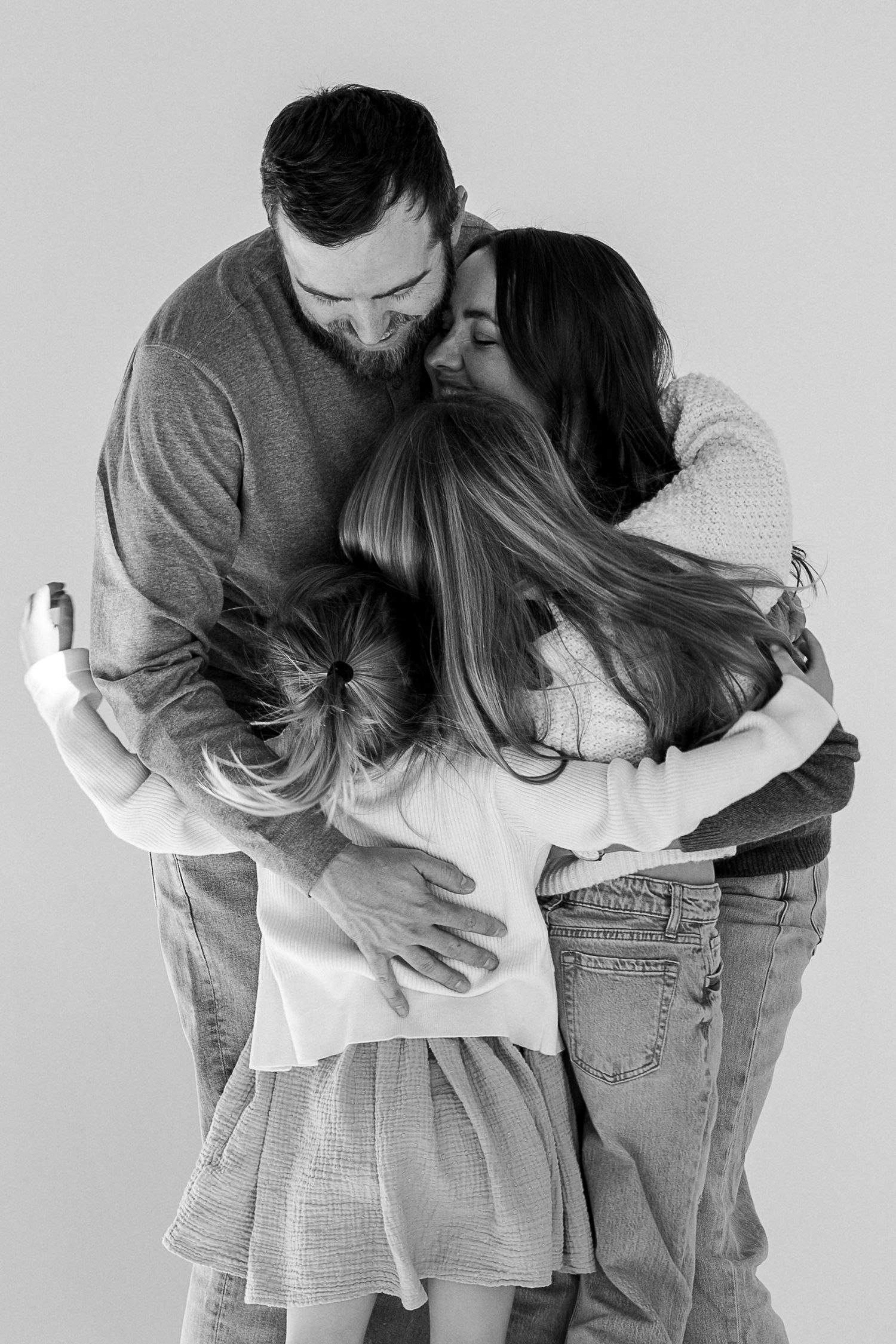 A romantic black and white photo sequence showing a couple embracing and sharing tender moments together.
