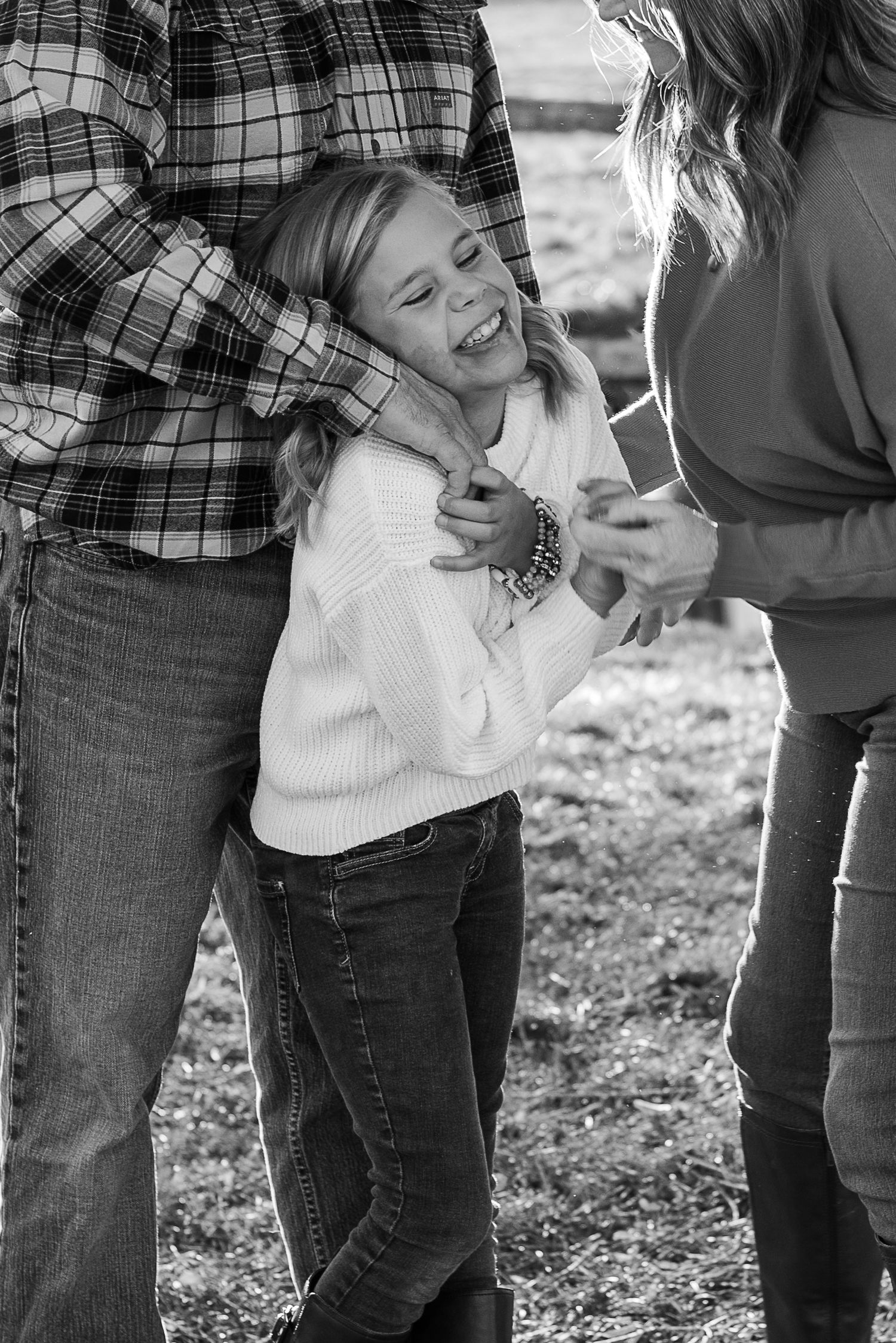 Candid family moment showing playful interaction and laughter.
