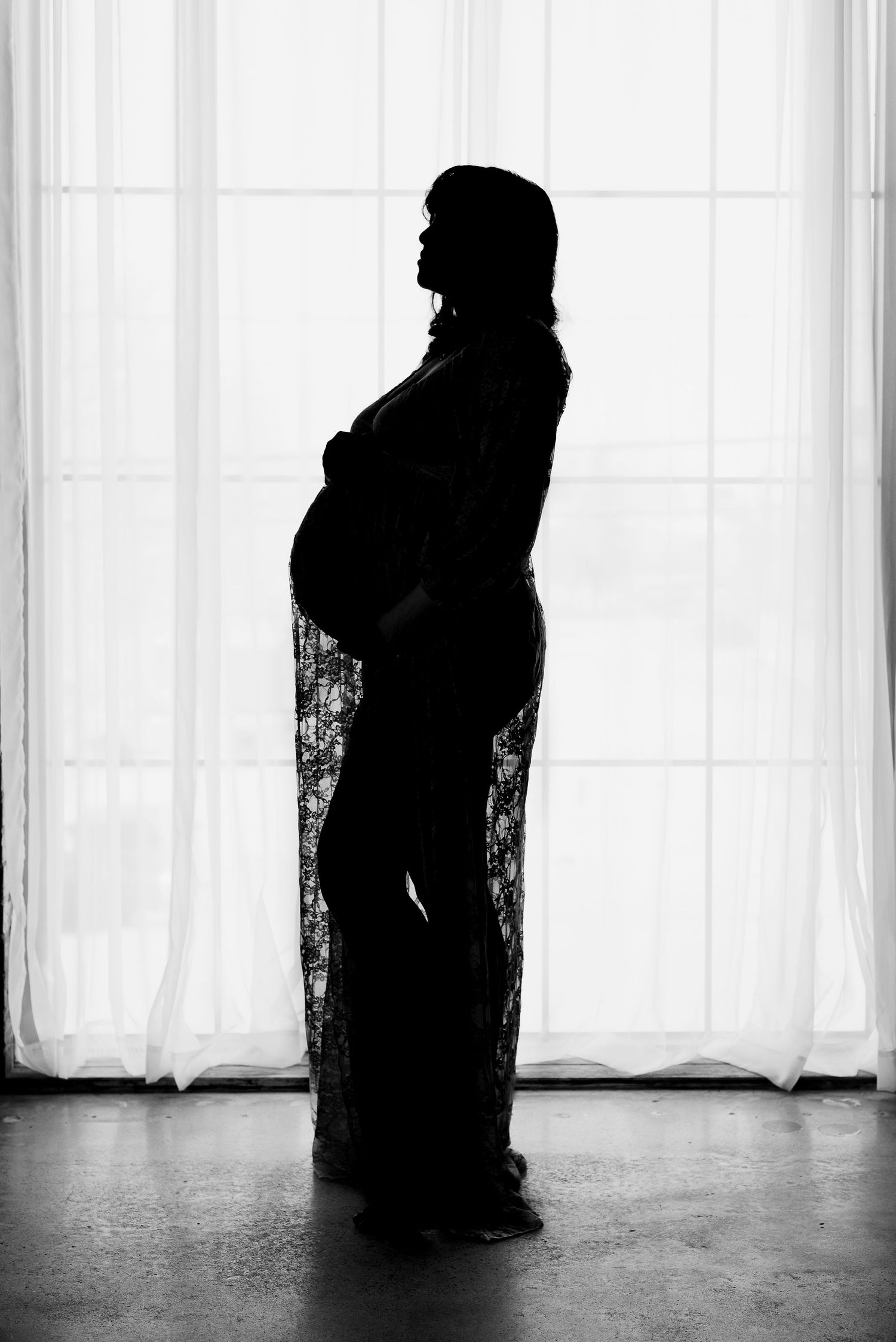 Silhouette of pregnant woman in studio