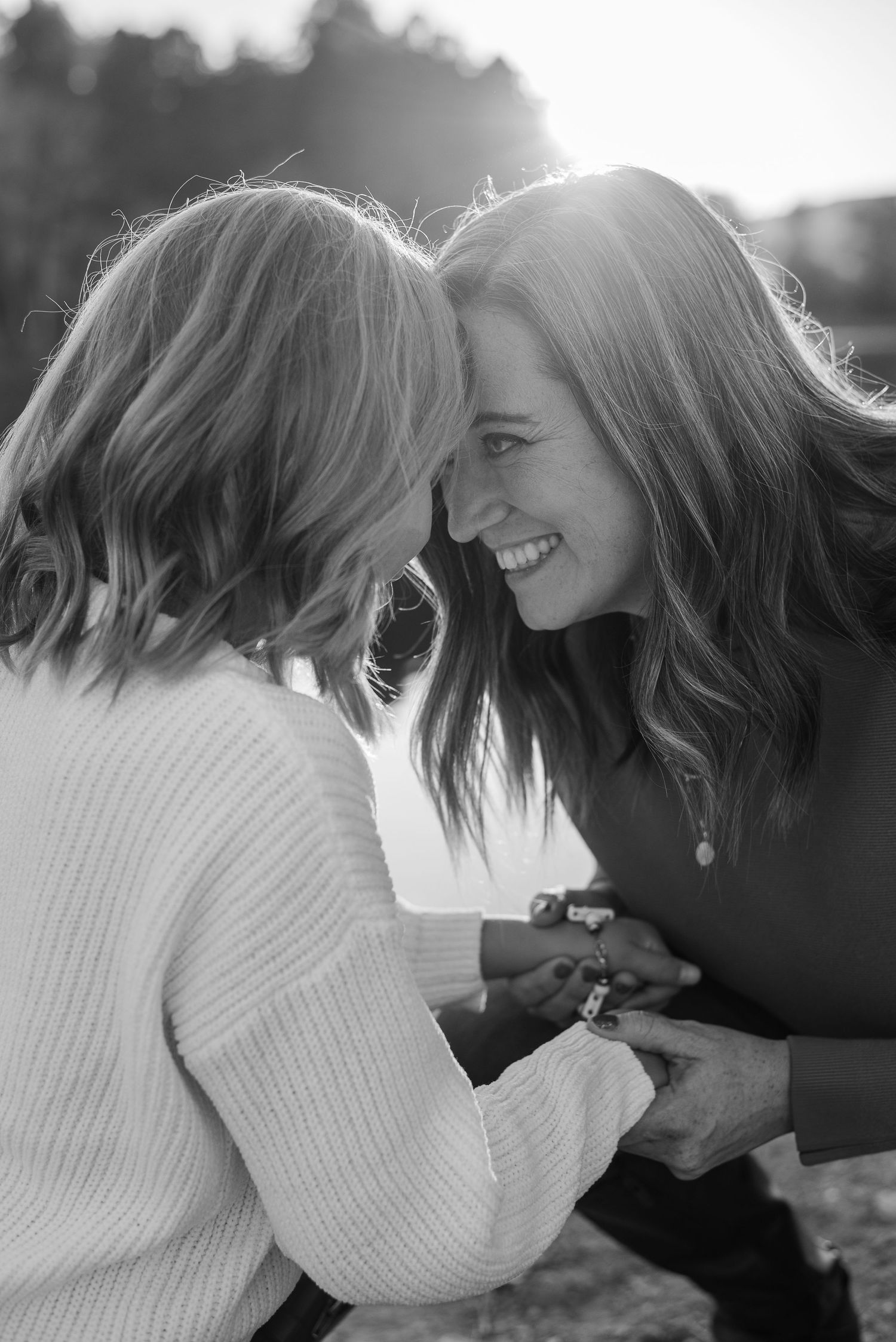 Black and white intimate family moment showing joy and connection.