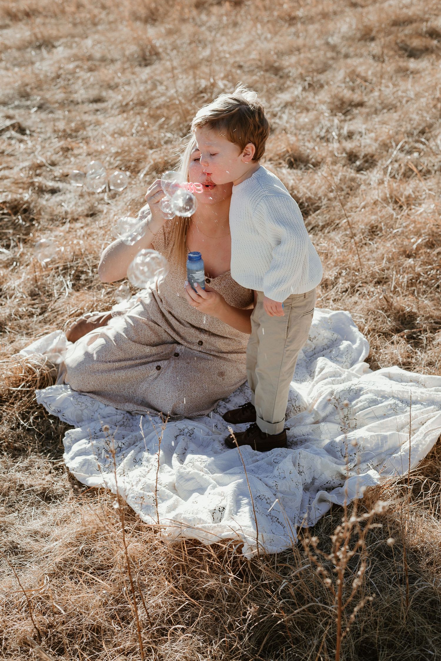 Mom and son blow bubbles
