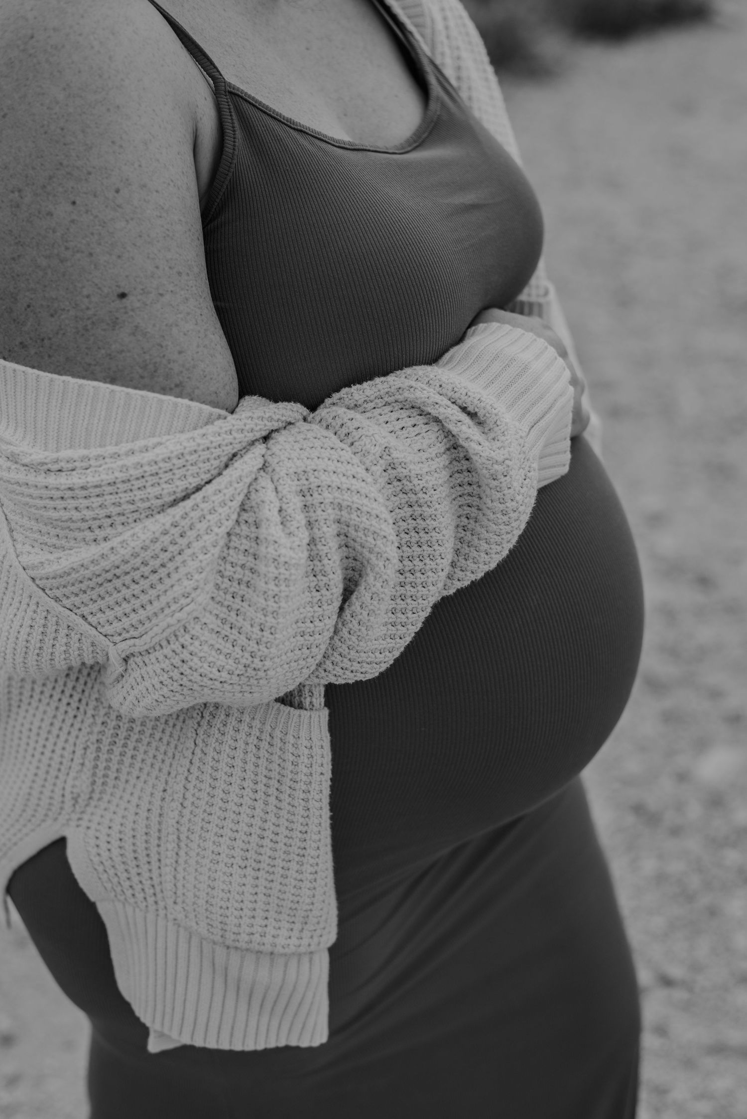 Black and white pregnant woman's belly