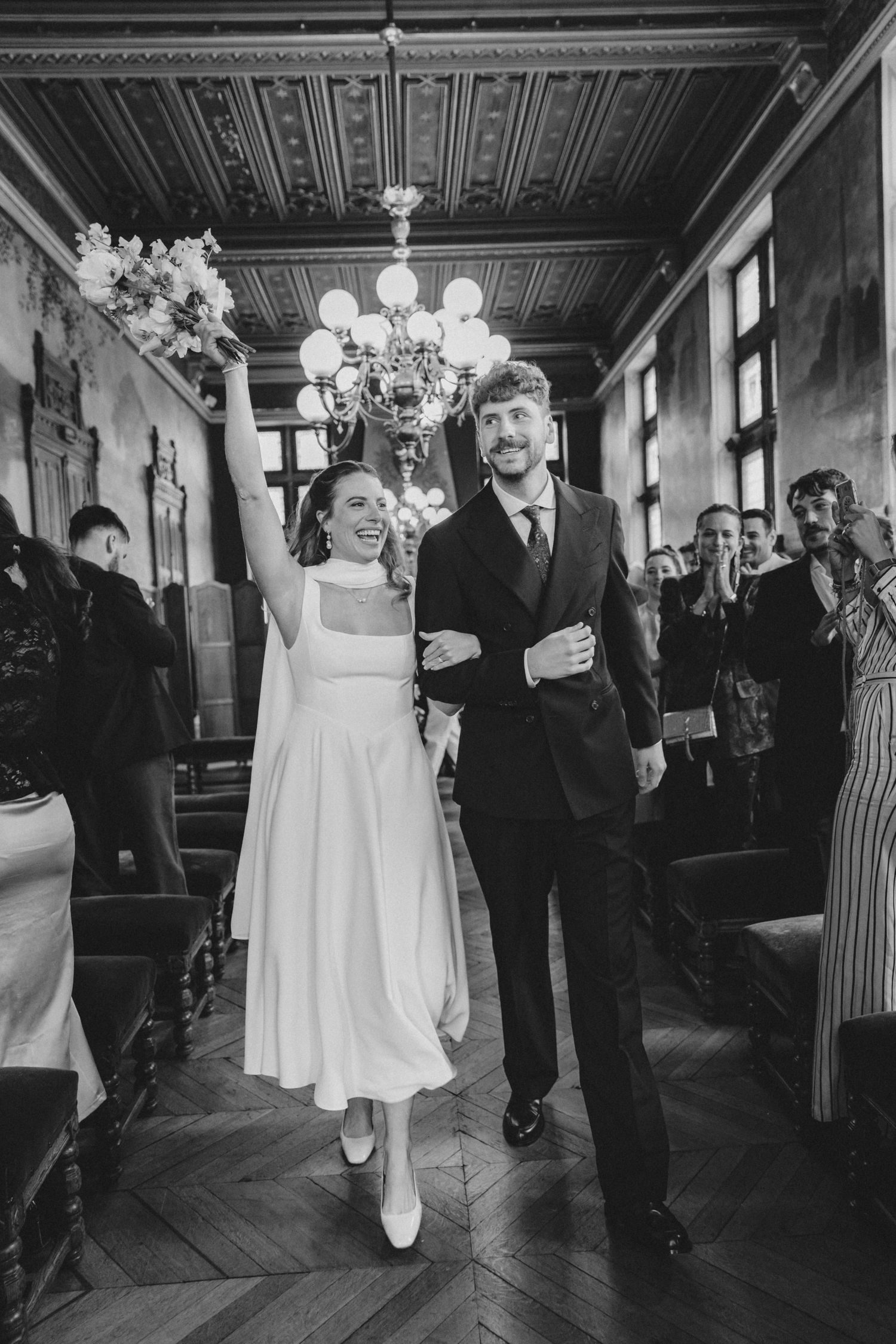Black and white photos show wedding couple dancing at reception in elegant vintage ballroom with ornate ceiling.