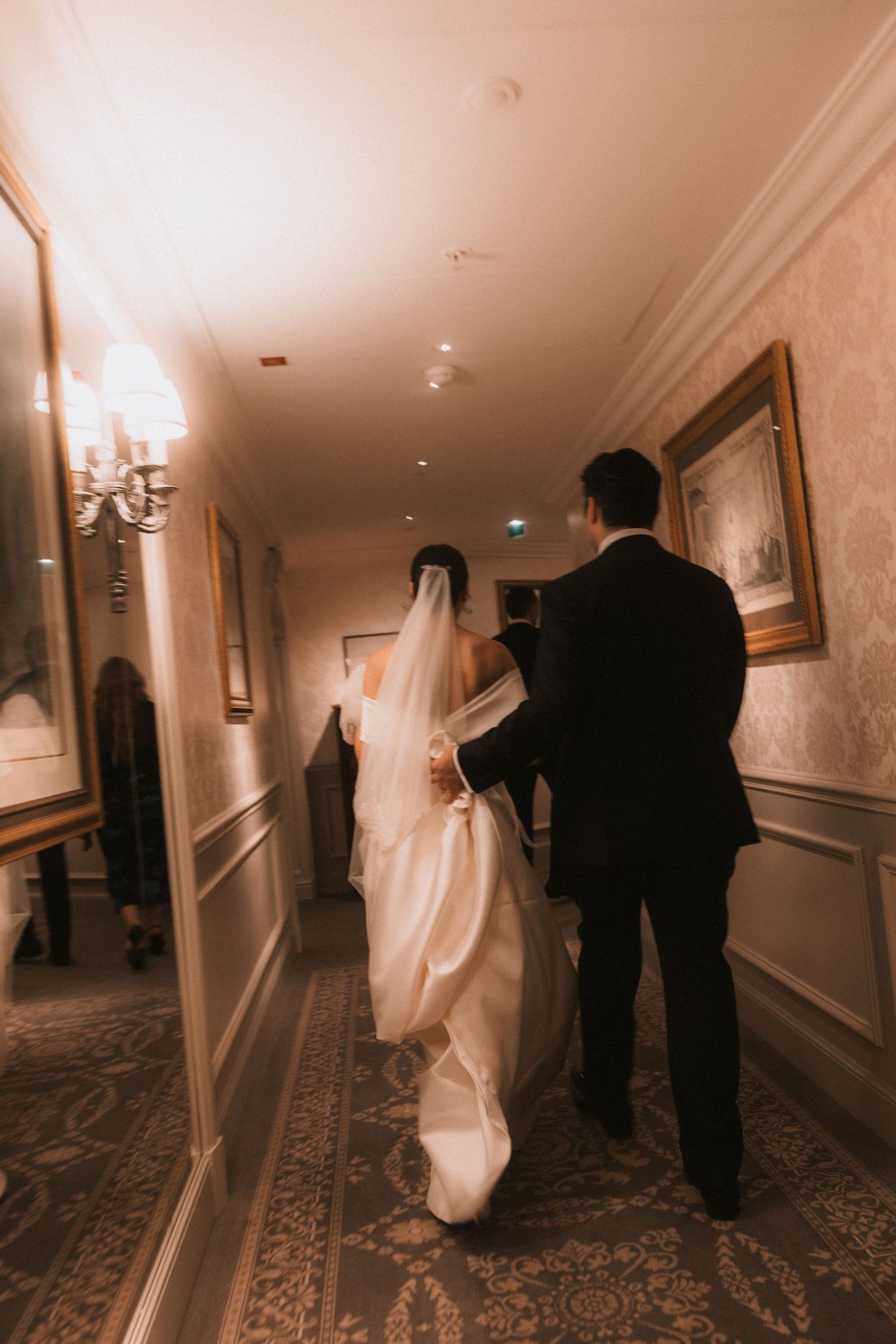 A sequence of four spooky hallway photos showing dark figures and ghostly white shapes in a dimly lit hotel corridor.