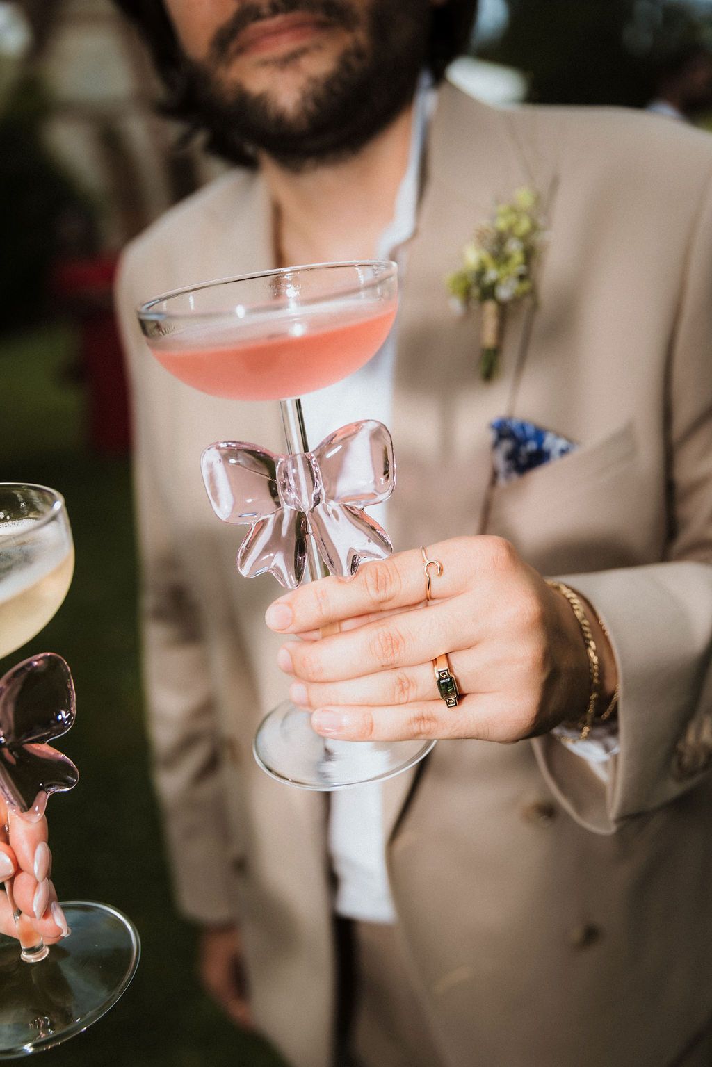 Playful wedding luxury: Chic pink cocktail & bow detail by Raw Studio Paris, editorial destination wedding photographer in France