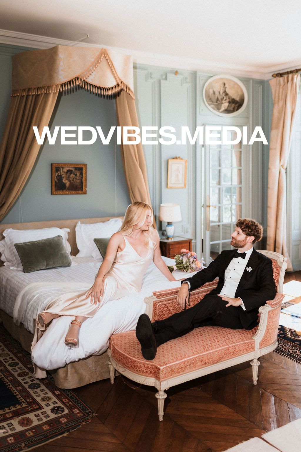 Vintage-inspired boudoir photoshoot on an antique chaise lounge in a luxurious blue room.