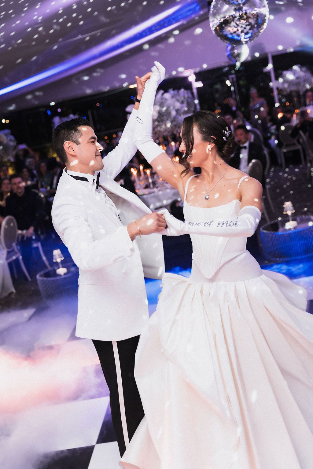Wedding party: Couple dancing in blue light by Raw Studio Paris, luxury cinematic destination wedding filmmaker & photo at Pre Catelan.
