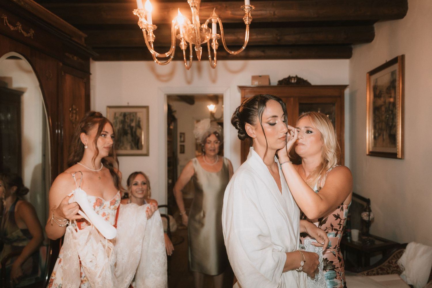Joyful wedding celebration moments captured in candid shots at an indoor venue with warm lighting and rustic decor.