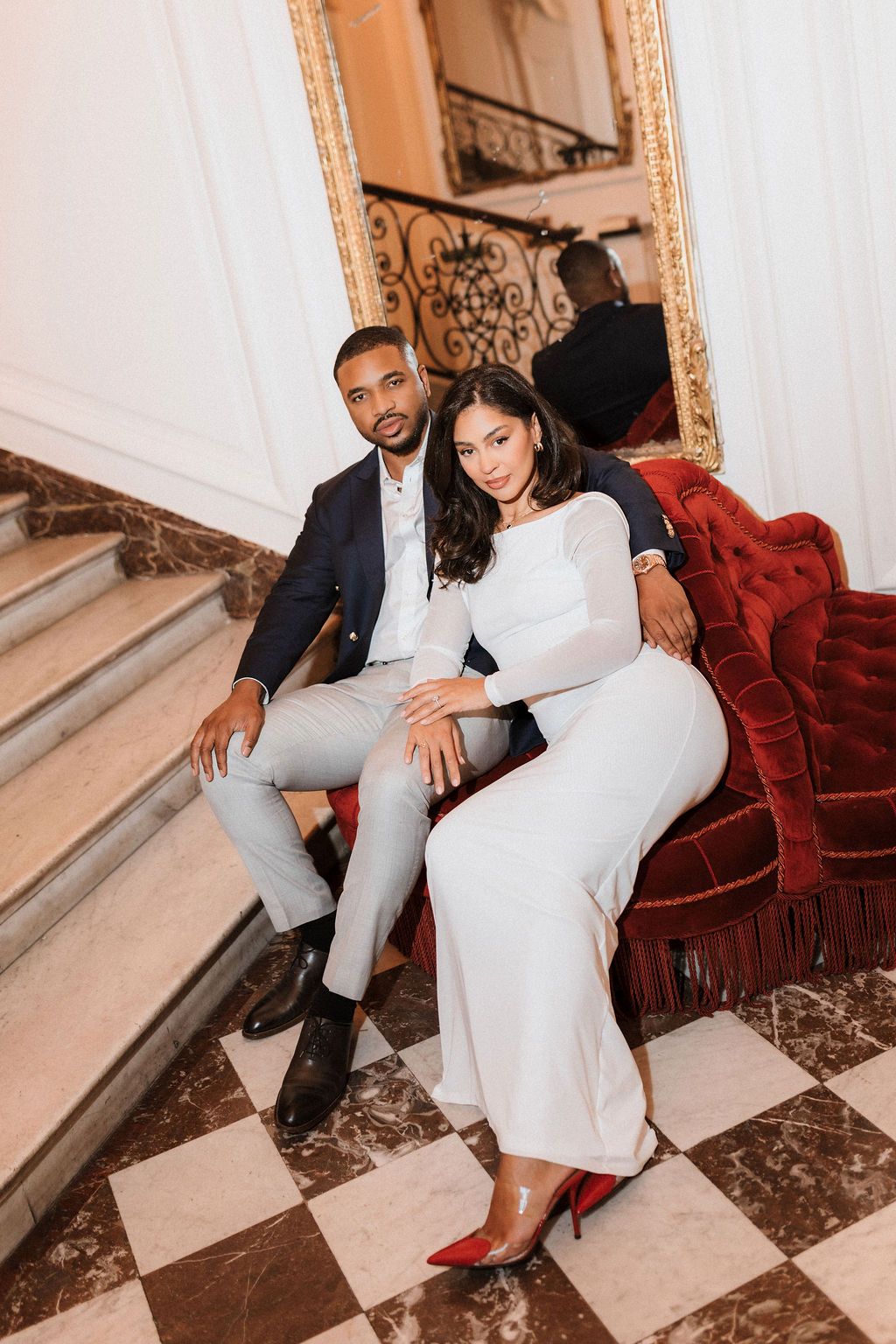 Alfred Sommier Paris: Couple on red velvet chair by Raw Studio Paris, luxury Art Director led destination wedding photographer, France