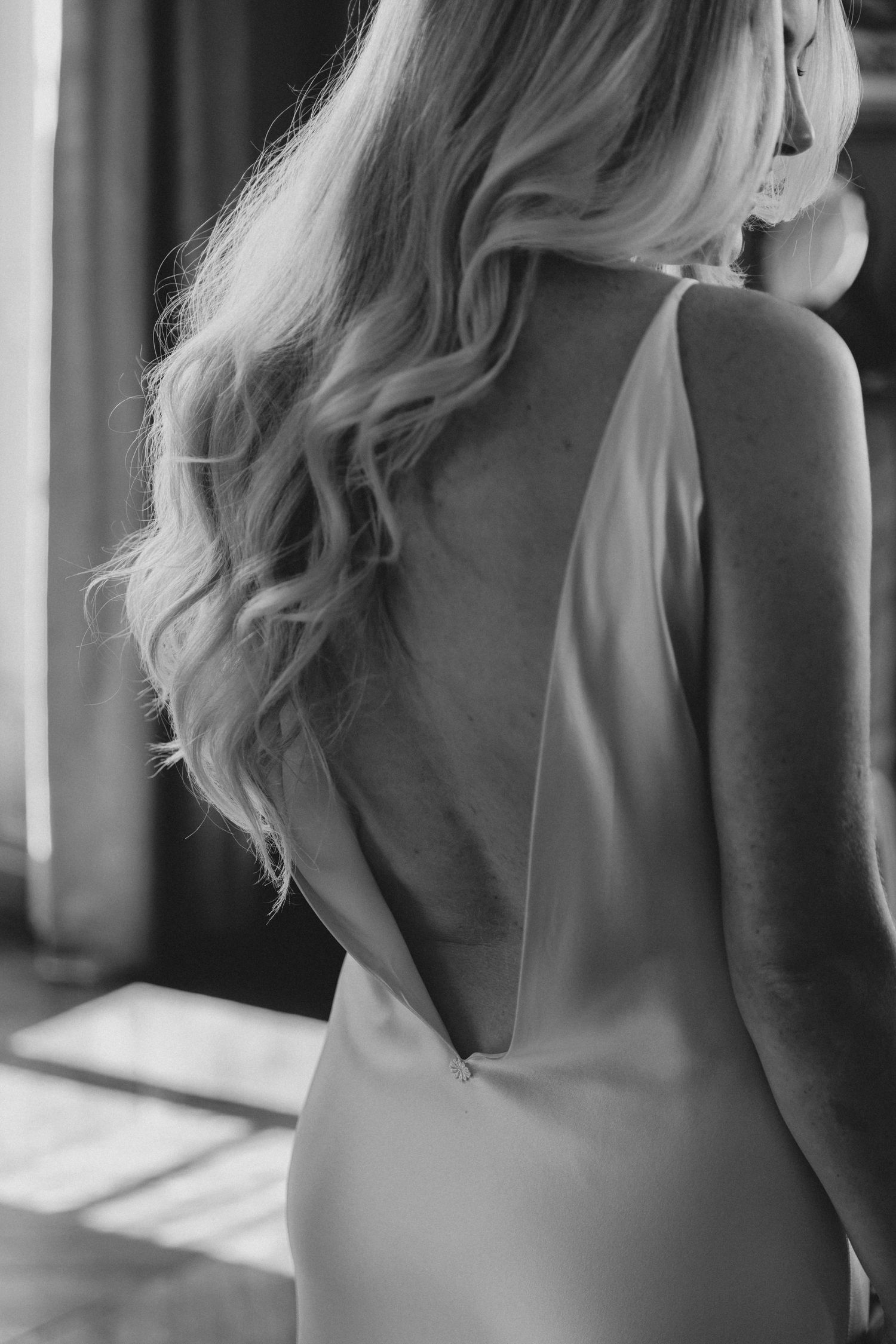 Close-up black and white portraits showing elegant blonde hair styling in soft window light.