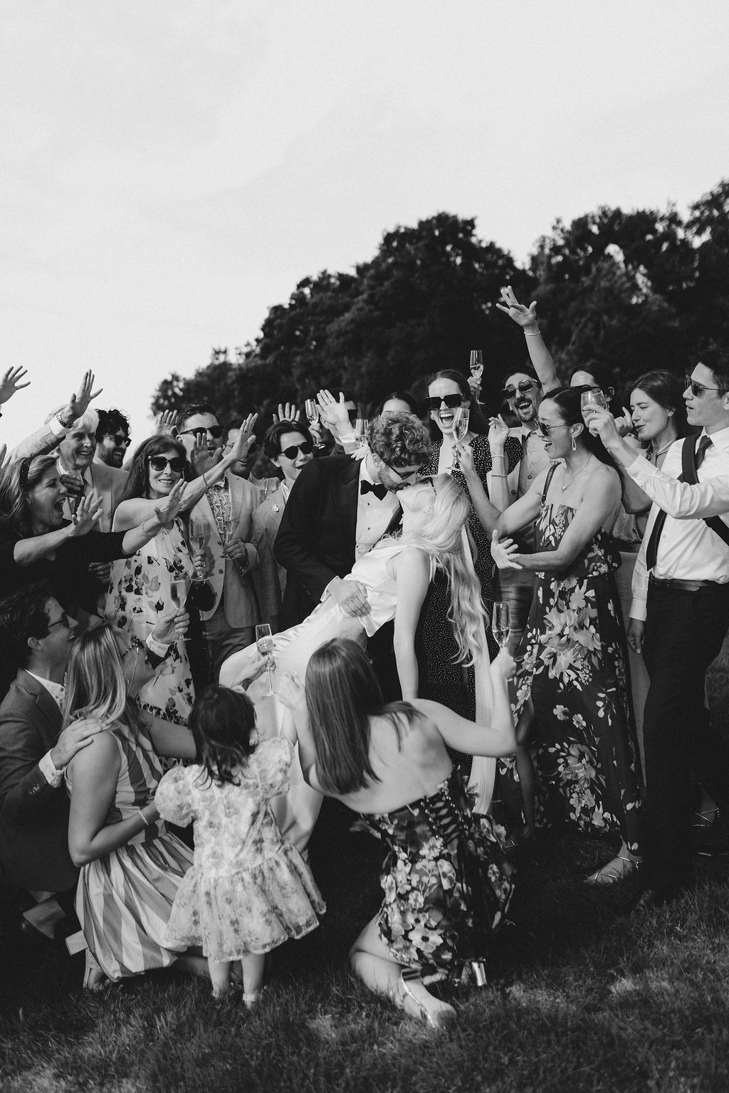 Joyful wedding celebration: B&W outdoor party by Raw Studio Paris, emotional documentary destination wedding photographer in France