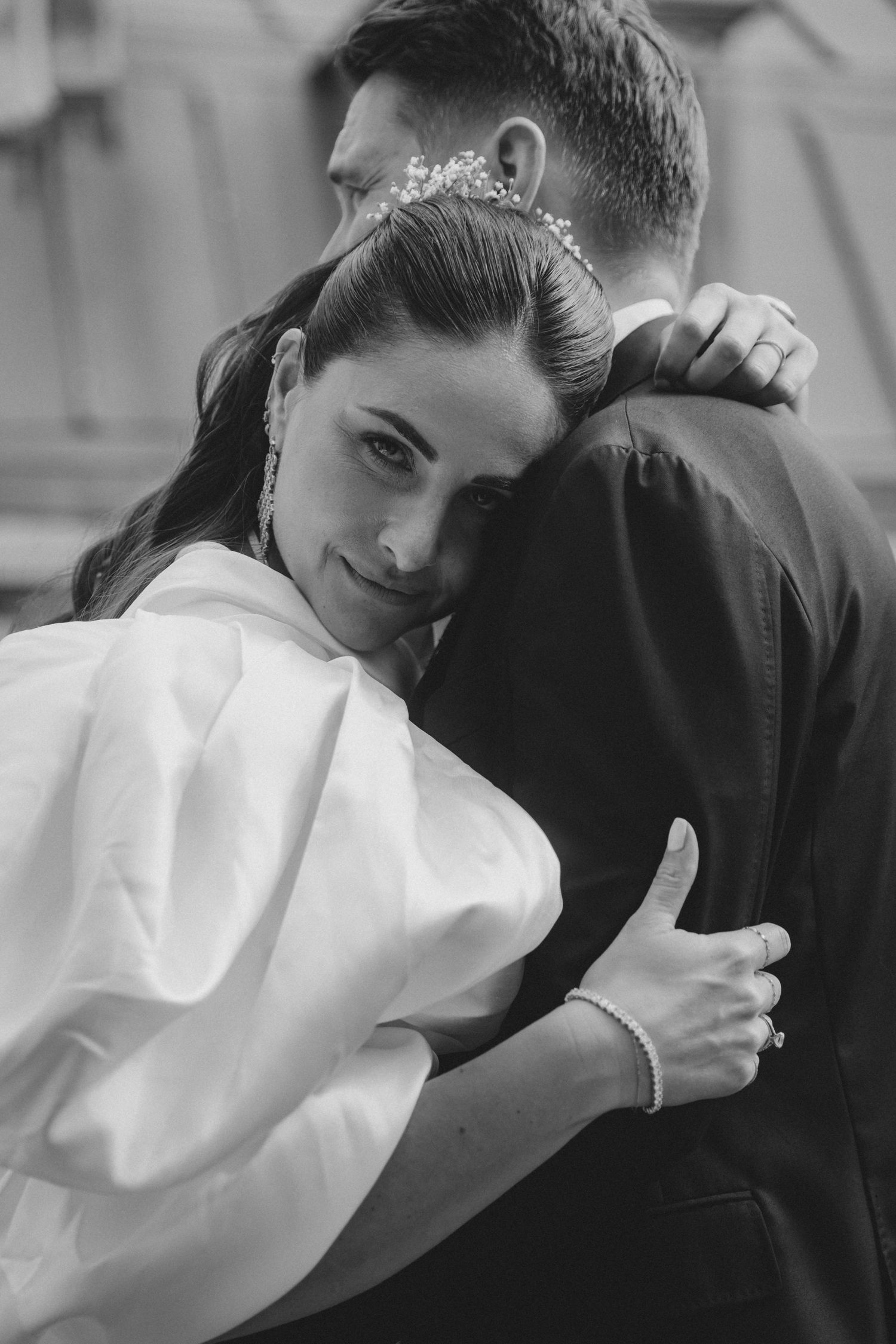 A sequence of intimate black and white close-up shots showing tender moments between two people.