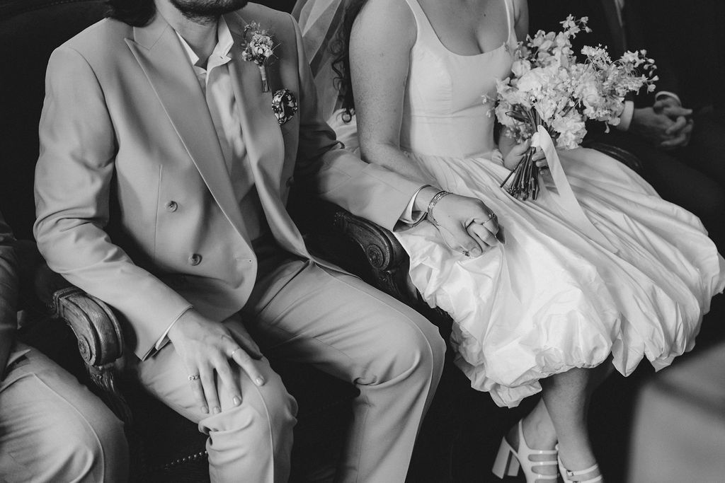 A black and white collage of wedding photos showing intimate moments between couples sitting together.