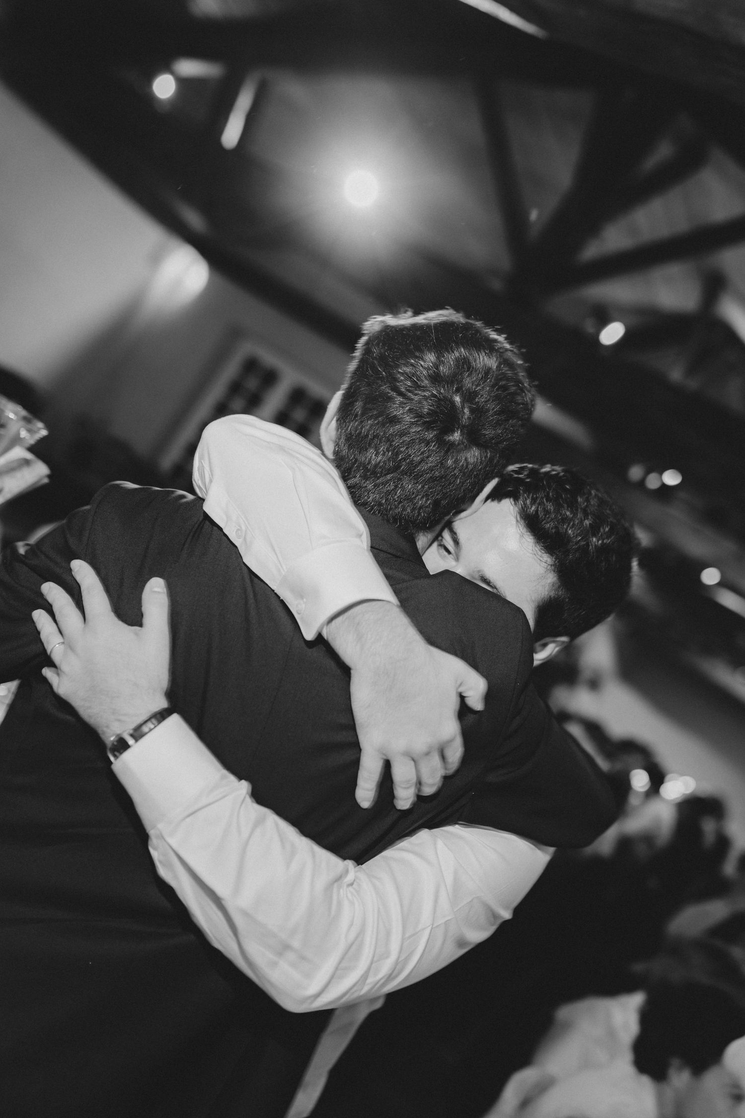 Black and white photos capture intimate dance floor moments between two people at a wedding reception.