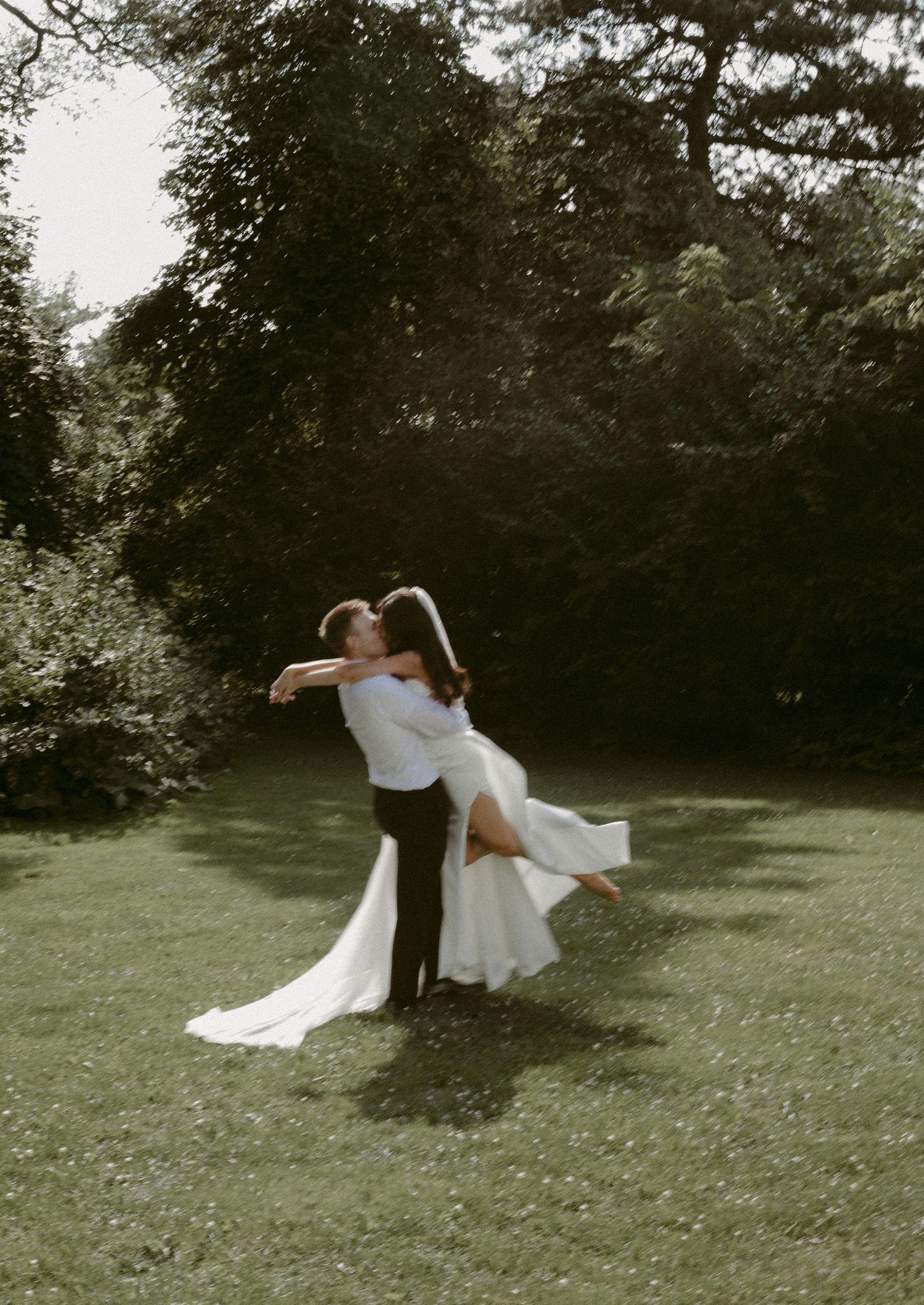 Couple spinning in the sunset at their Muskoka wedding.