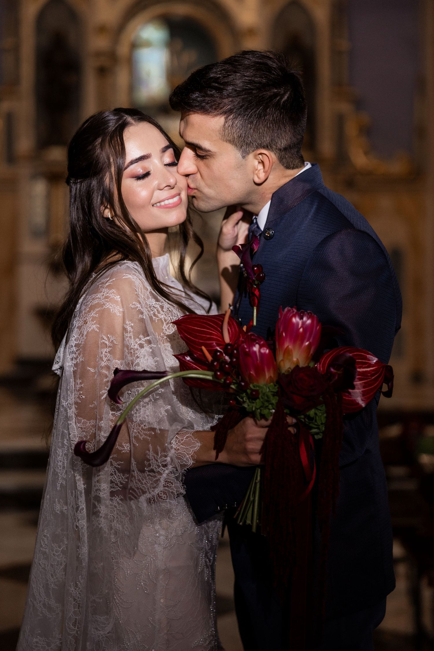 A romantic sequence of wedding photos showing a couple sharing intimate moments with red roses in an ornate setting. Jardins del Tancat.