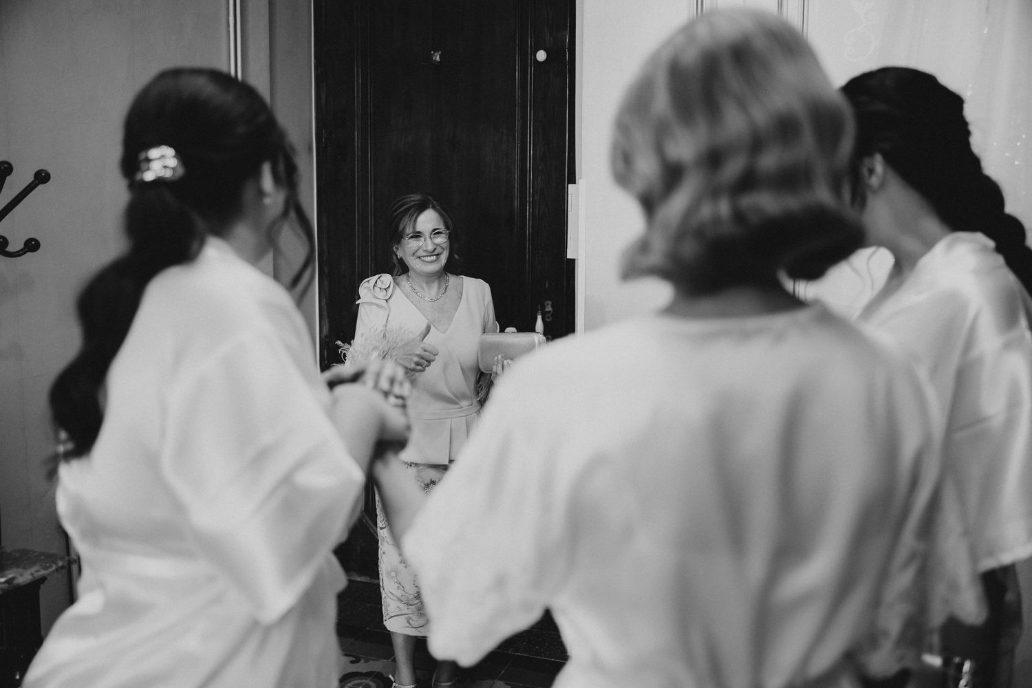 Black and white photo sequence showing people dancing and celebrating at what appears to be a wedding reception. Wedding in Villa Retiro.