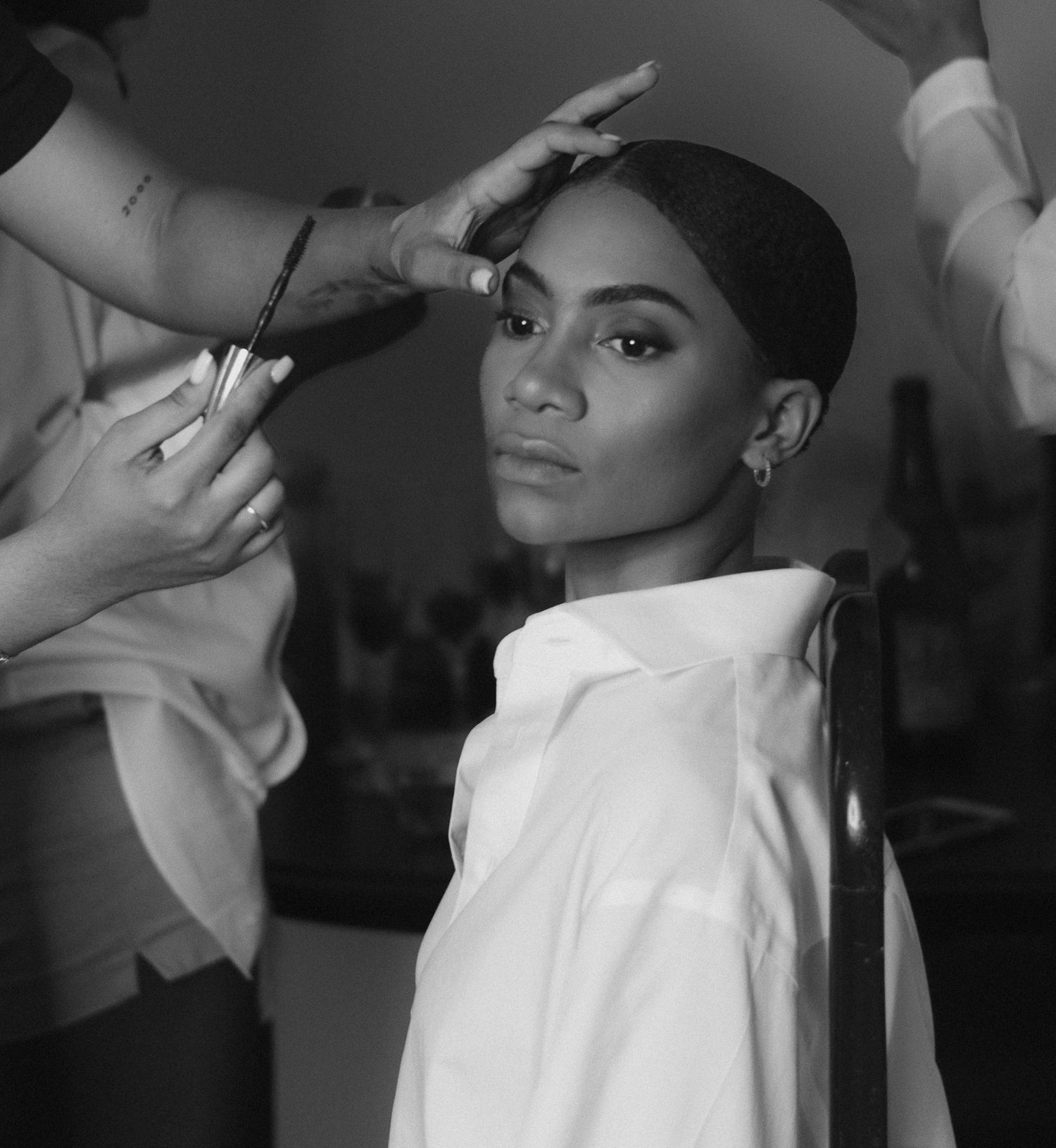 Dramatic black and white fashion photoshoot with artistic lighting and styling.