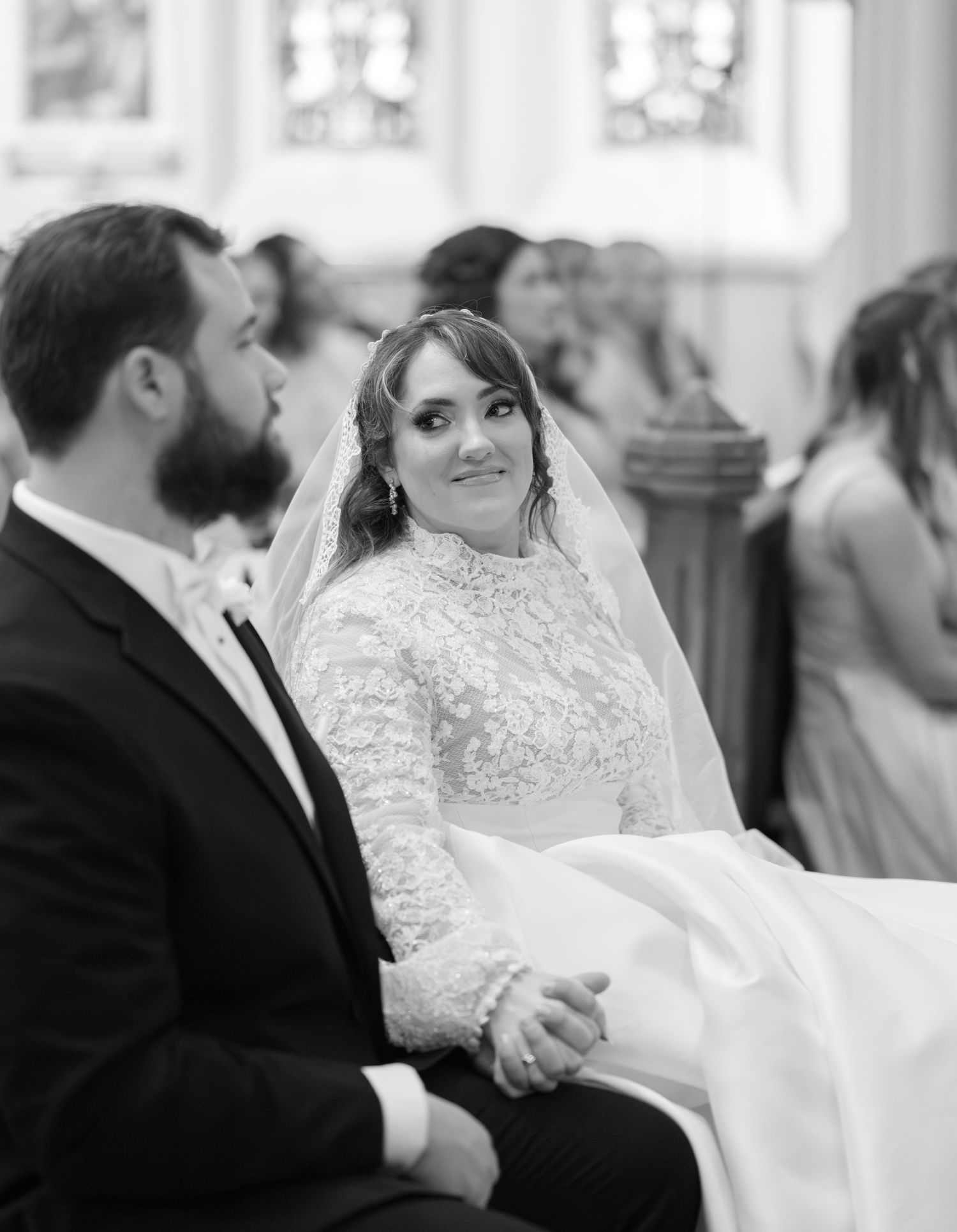 Black and white photos capturing intimate wedding ceremony moments in a church setting.