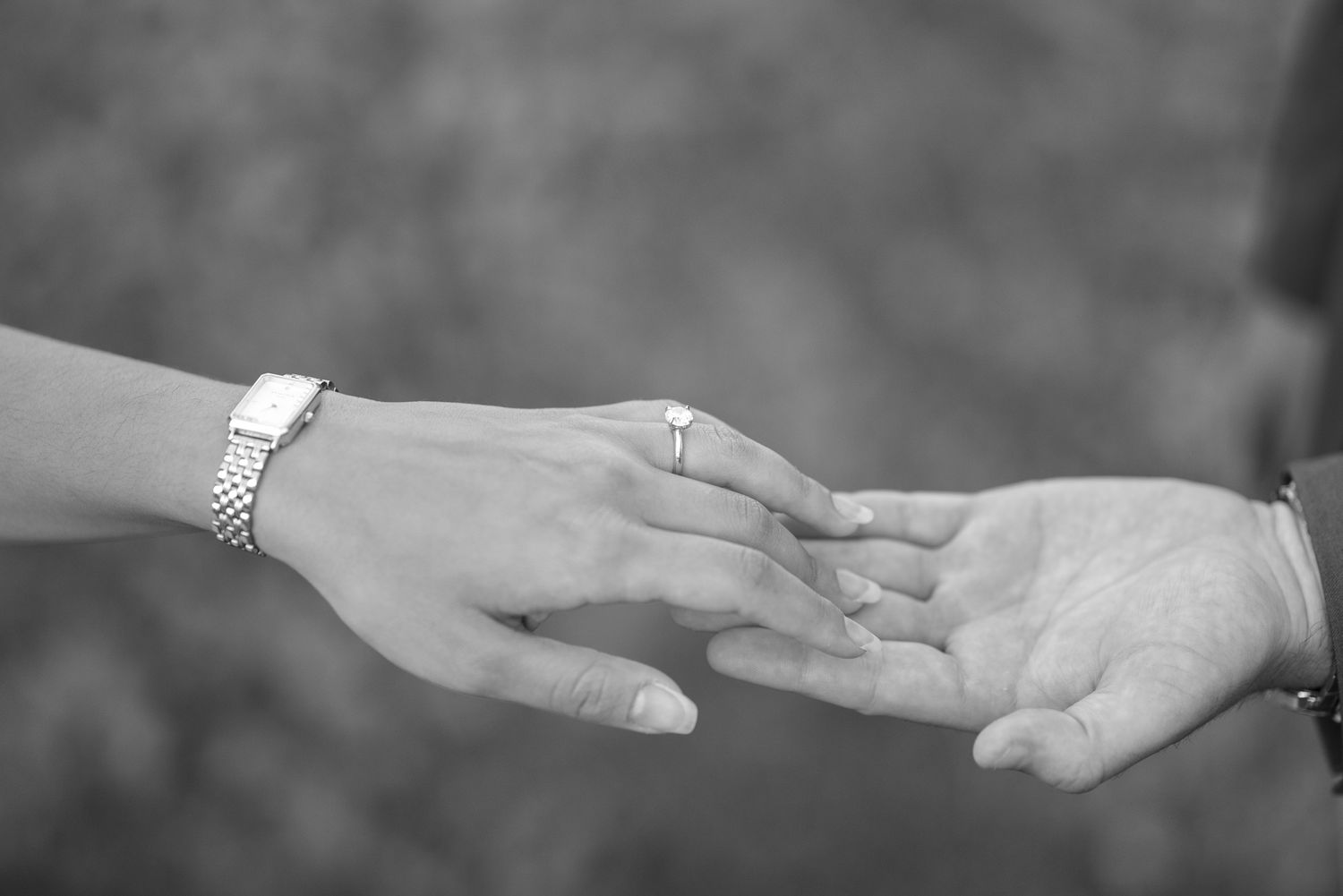 Series of hands reaching toward each other in black and white.