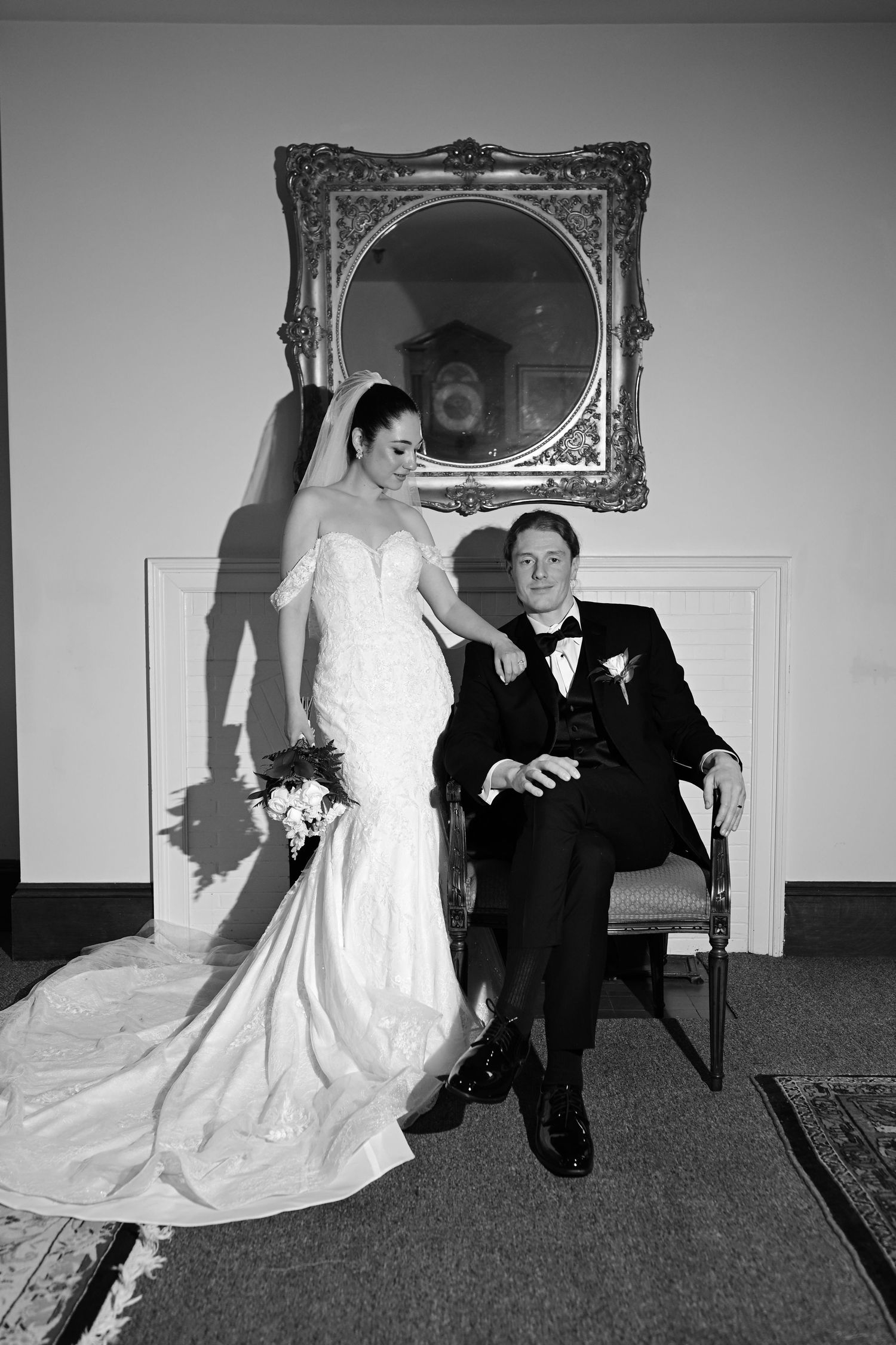 Black and white wedding portraits showing couple posing in formal indoor setting.