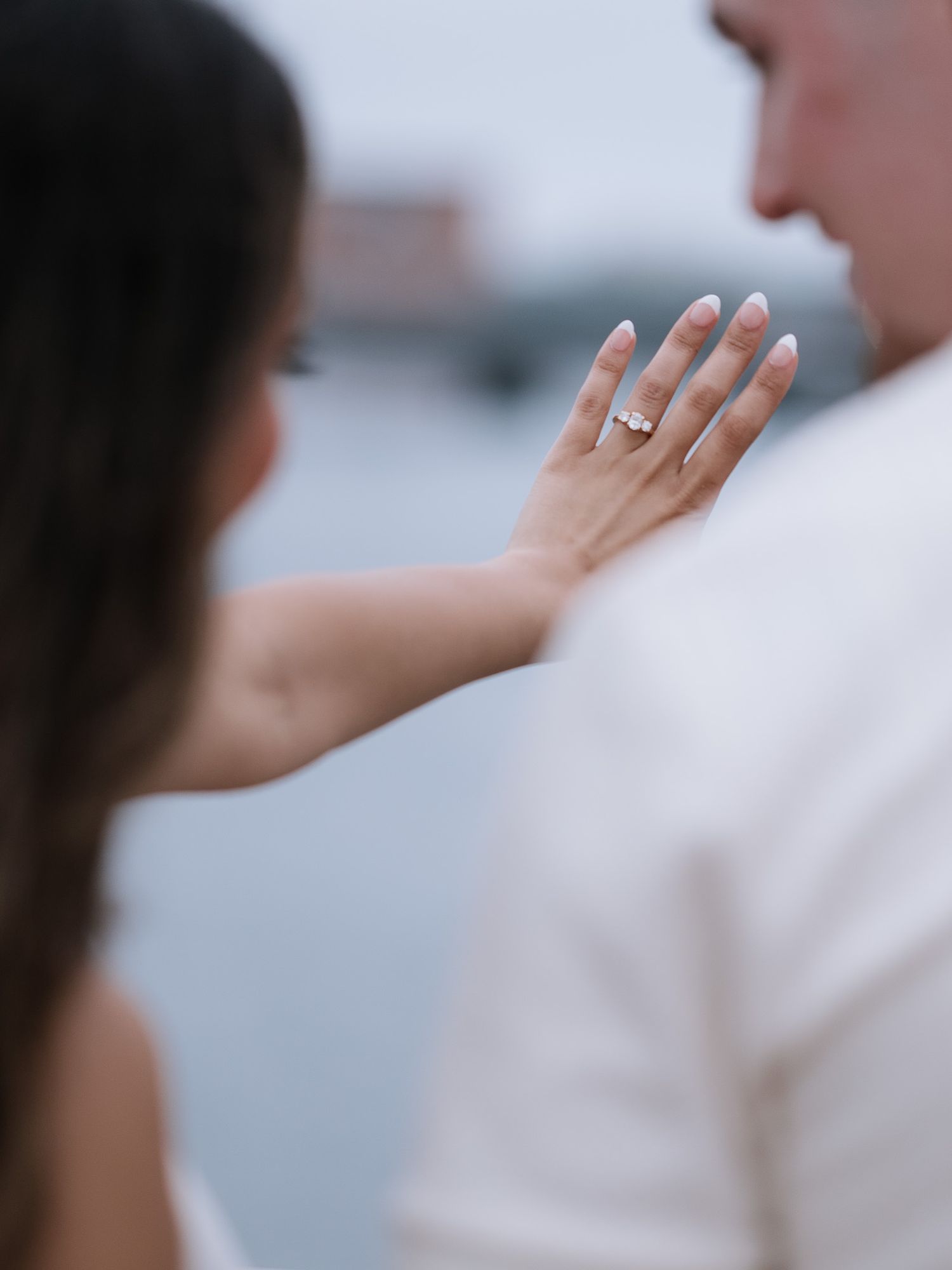 Close-up of couple's tender interaction during photoshoot.