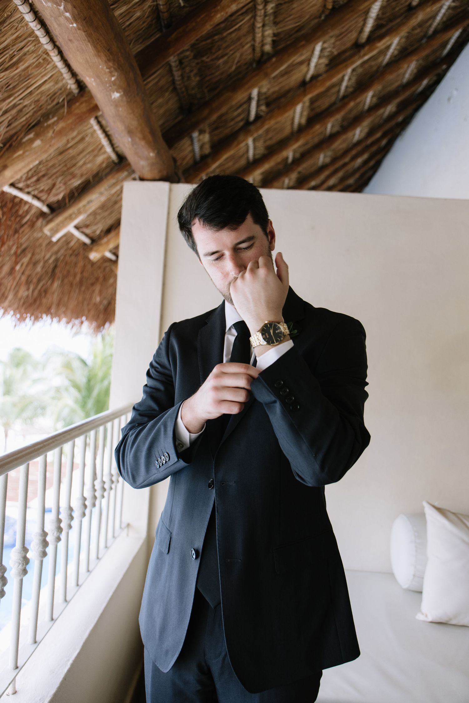 Series of emotional reactions captured under a thatched roof patio setting.