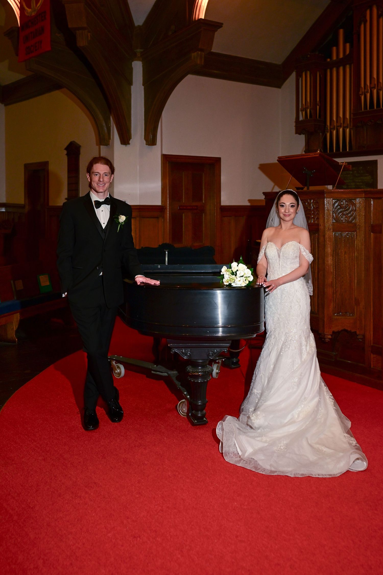 Series of wedding photos showing playful moments on a red carpet near a piano in a church setting.
