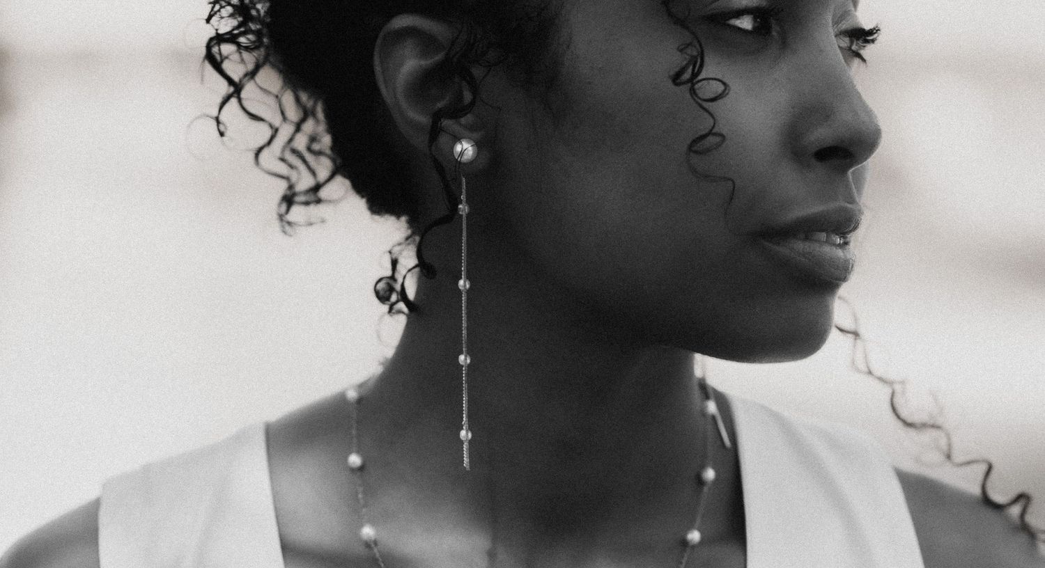 Close-up profile portraits showing elegant bridal jewelry and hairstyling.