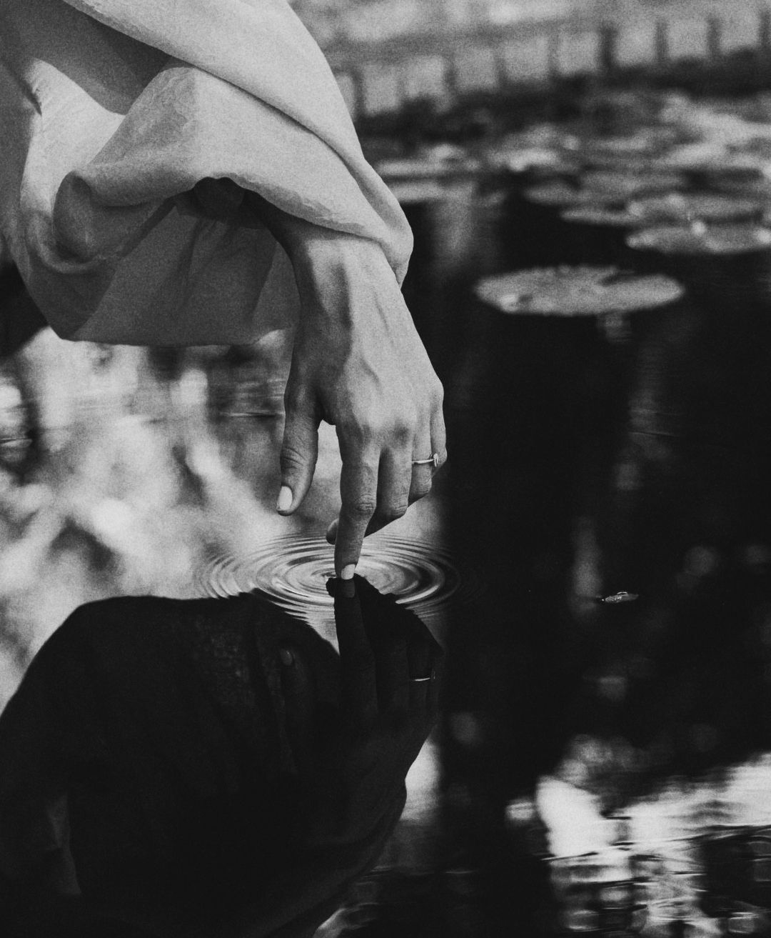 Artistic black and white reflection shots near water.
