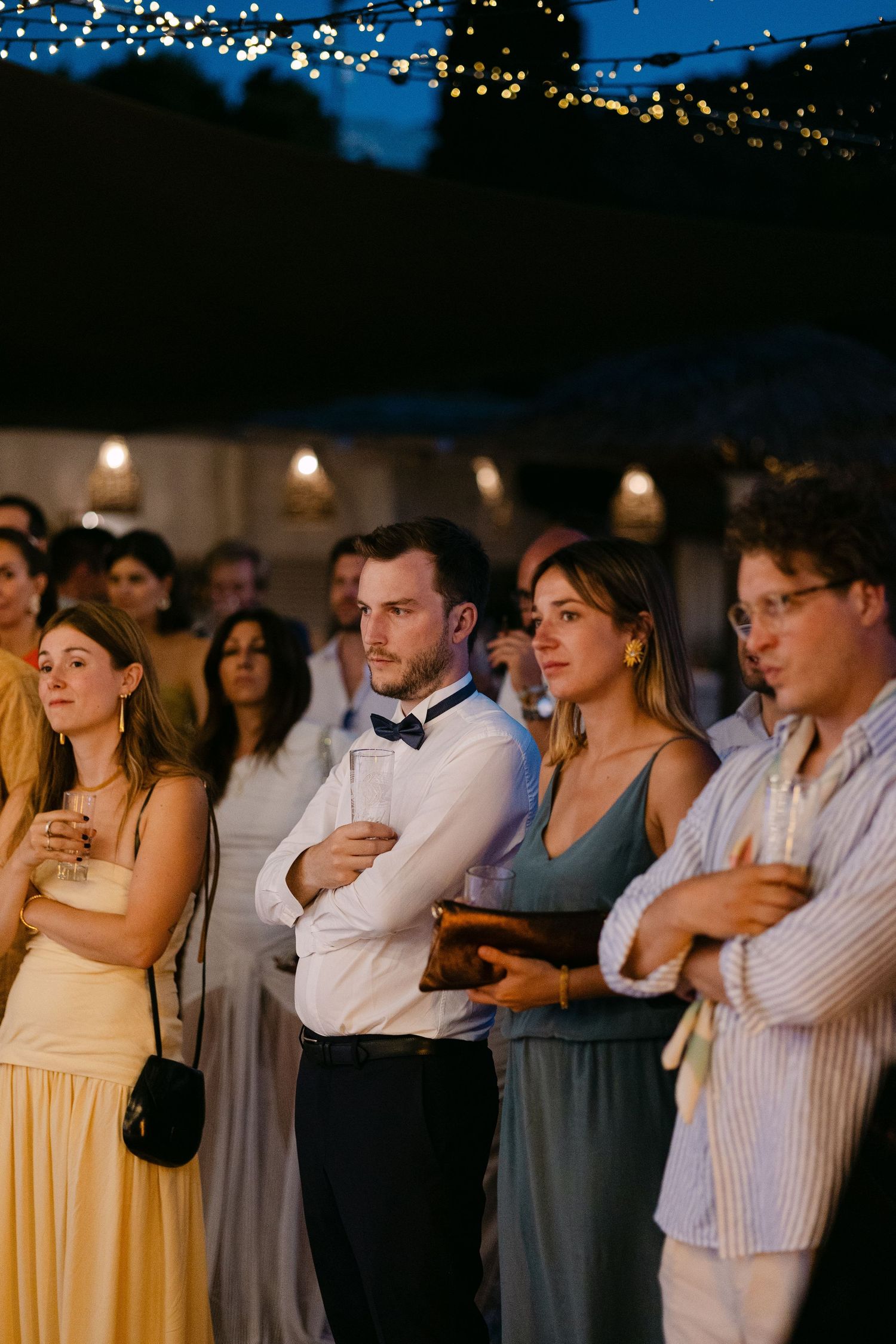 guests listening attentively to a speech and being concentrated and emotional