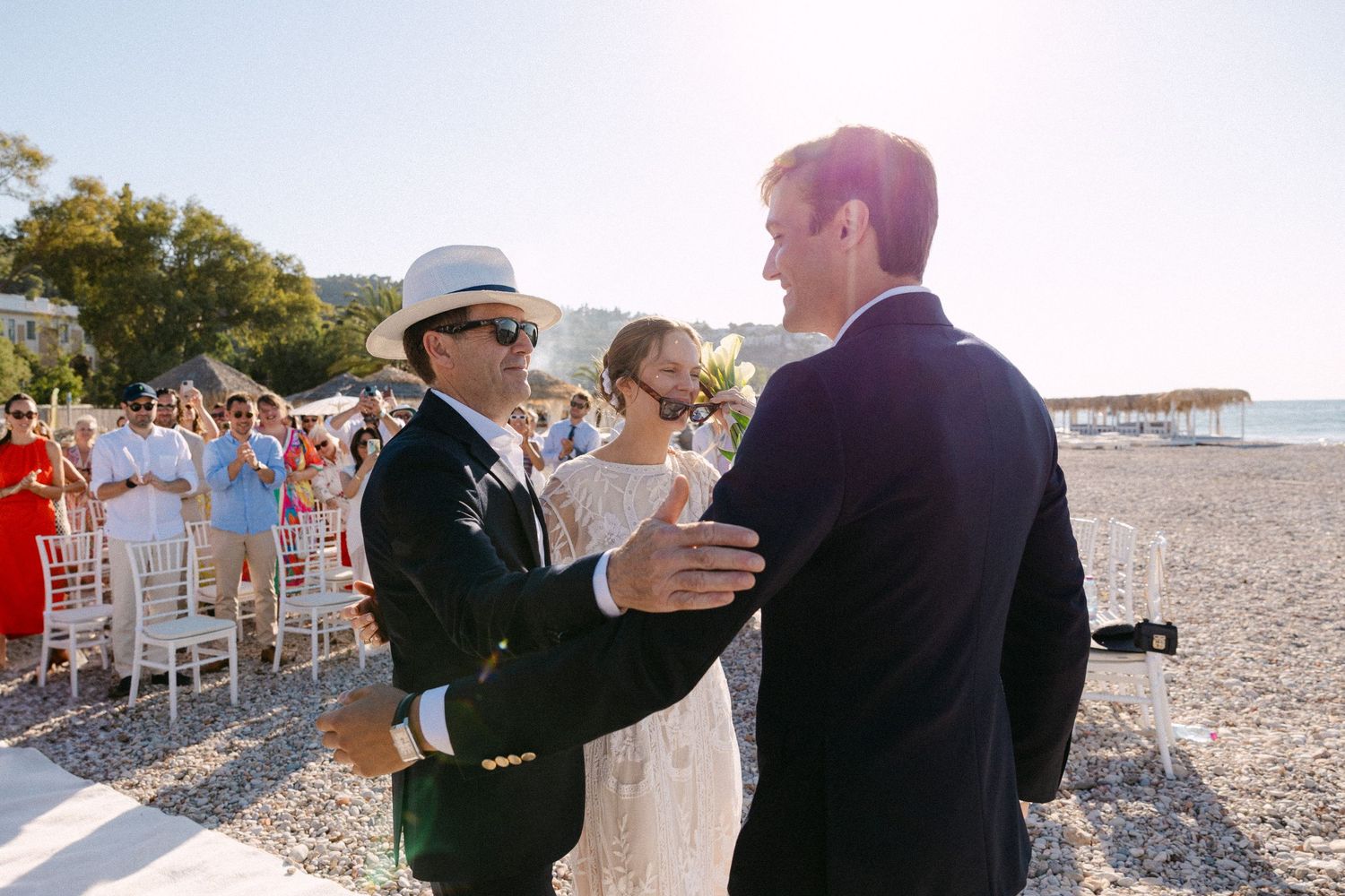 a dad walking his bride daughter towards the groom on their wedding ceremony
