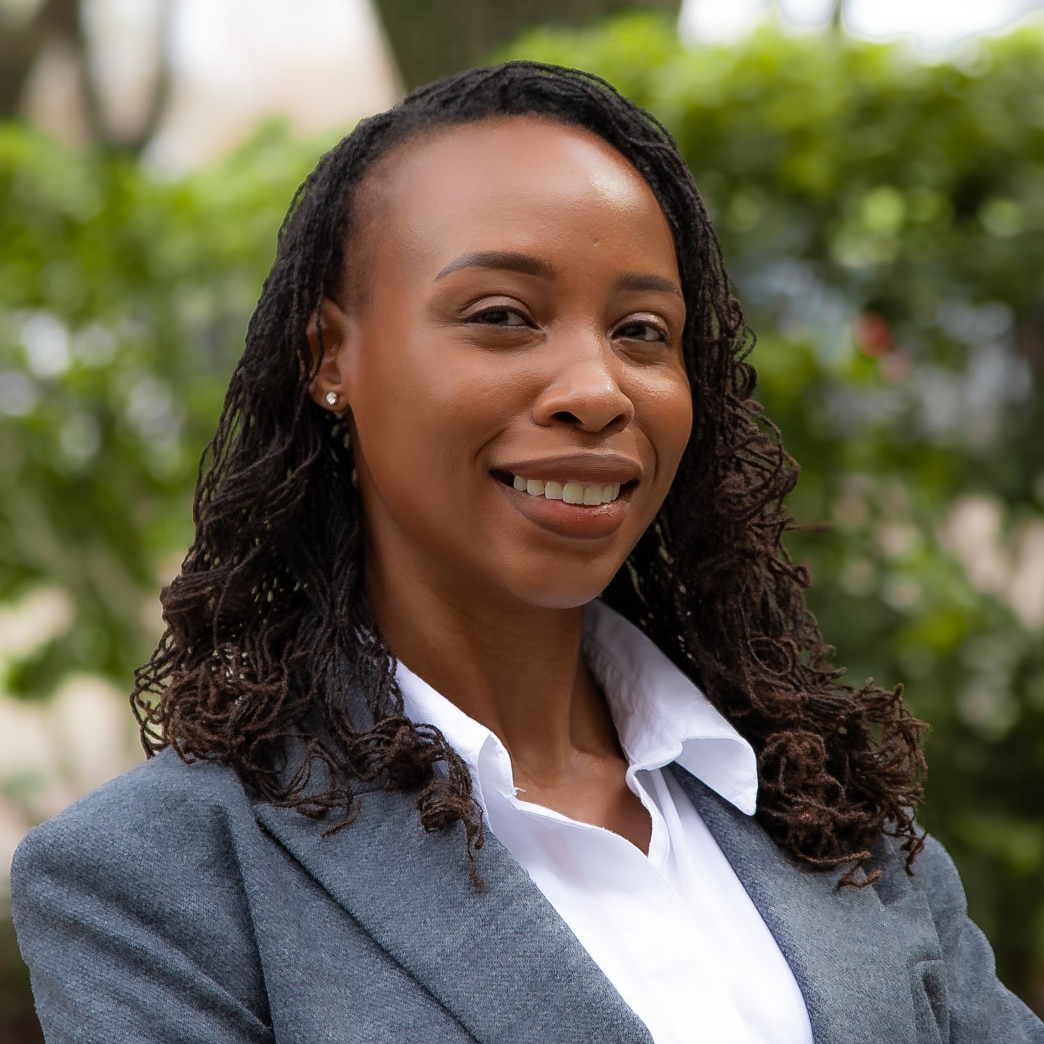 Professional headshot series showing warm expressions and curly hair against a soft blurred outdoor background.
