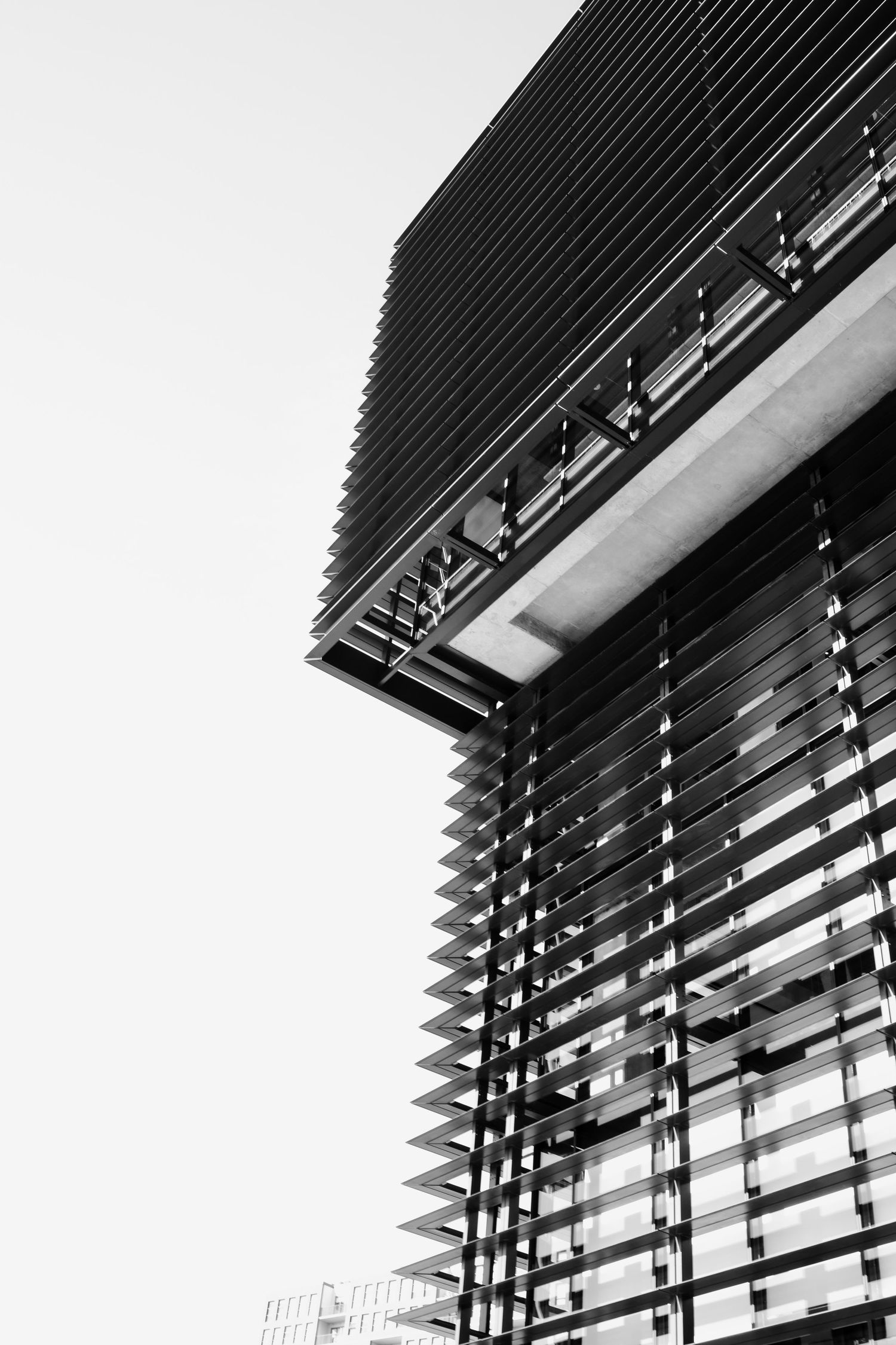 Abstract architectural detail of modern building with geometric black sunshades.