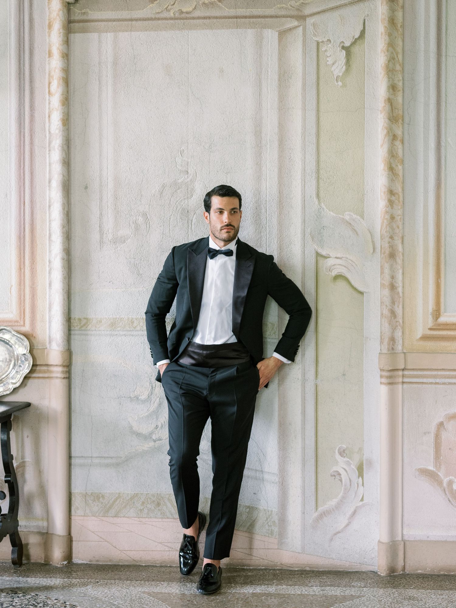 Classic black and white portrait session against ornate architectural details.