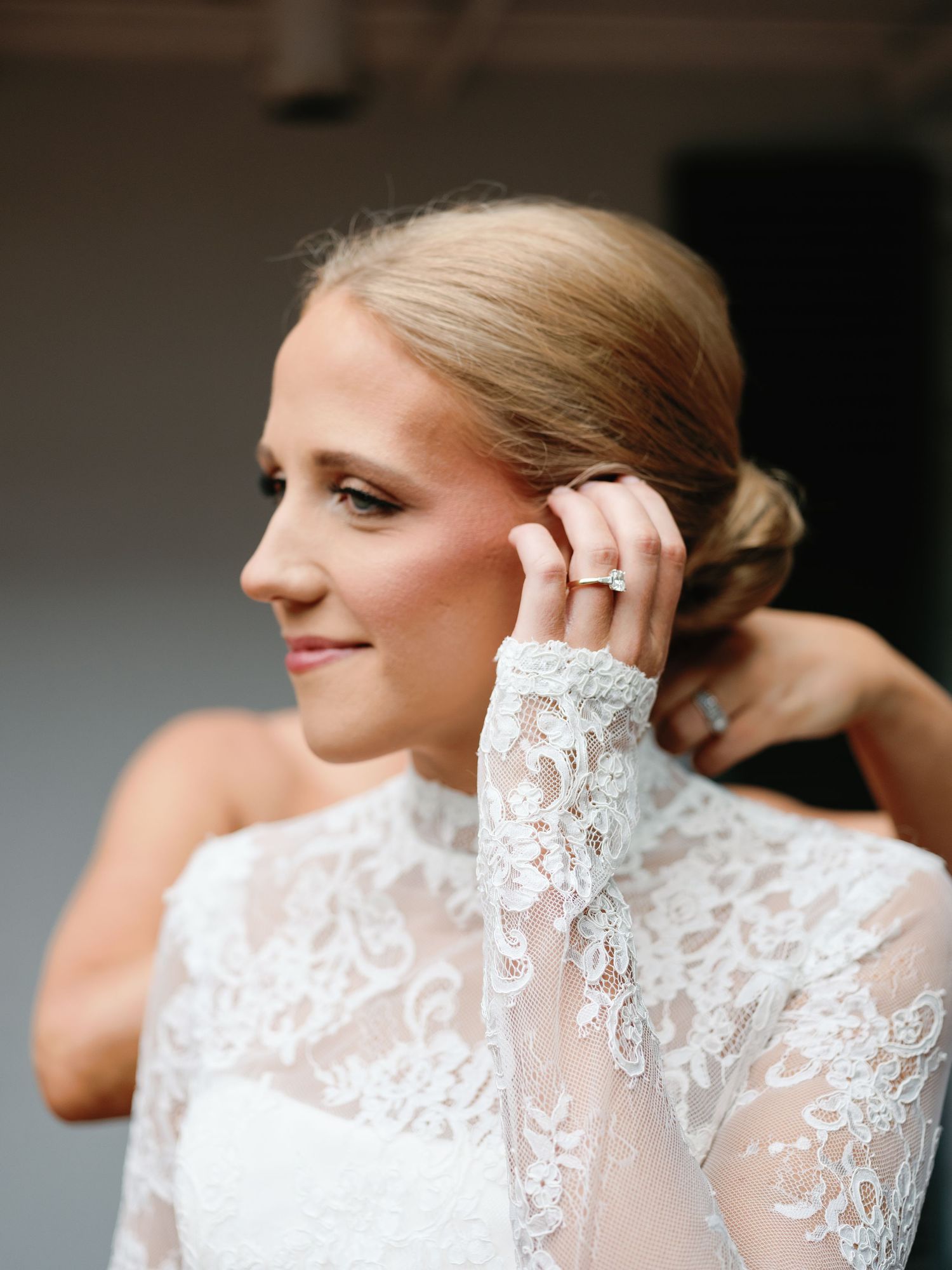 Elegant bridal portrait showcasing intricate lace details and classic styling.