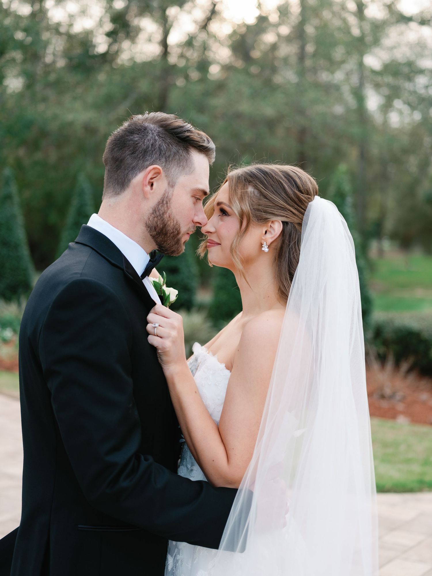 Intimate wedding portraits captured in soft natural light showing tender moments between newlyweds.