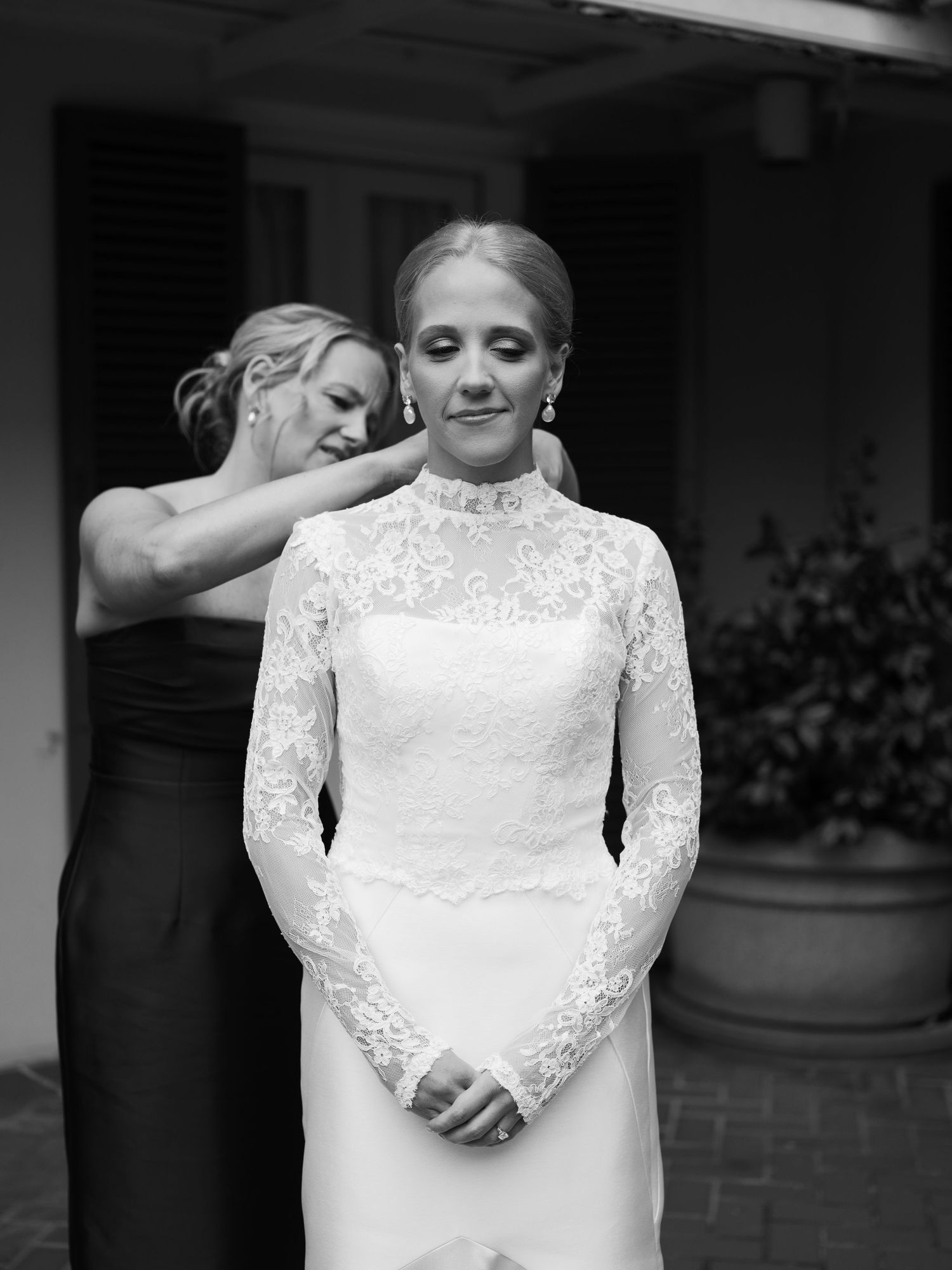 Black and white portrait of wedding dress details with lace bodice.