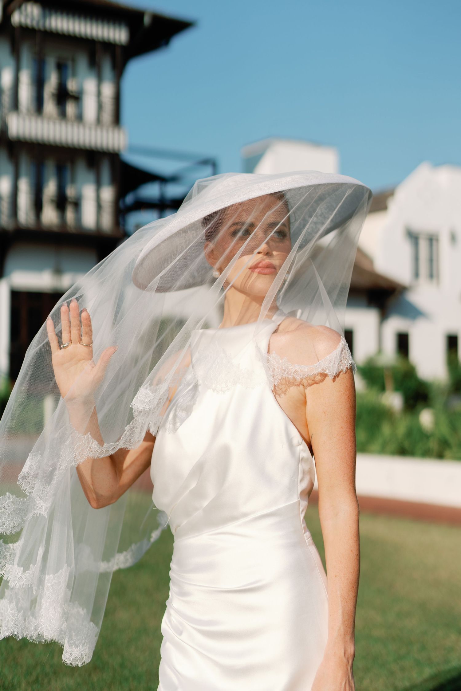 Elegant bridal veil flowing in the breeze on a sunny day.