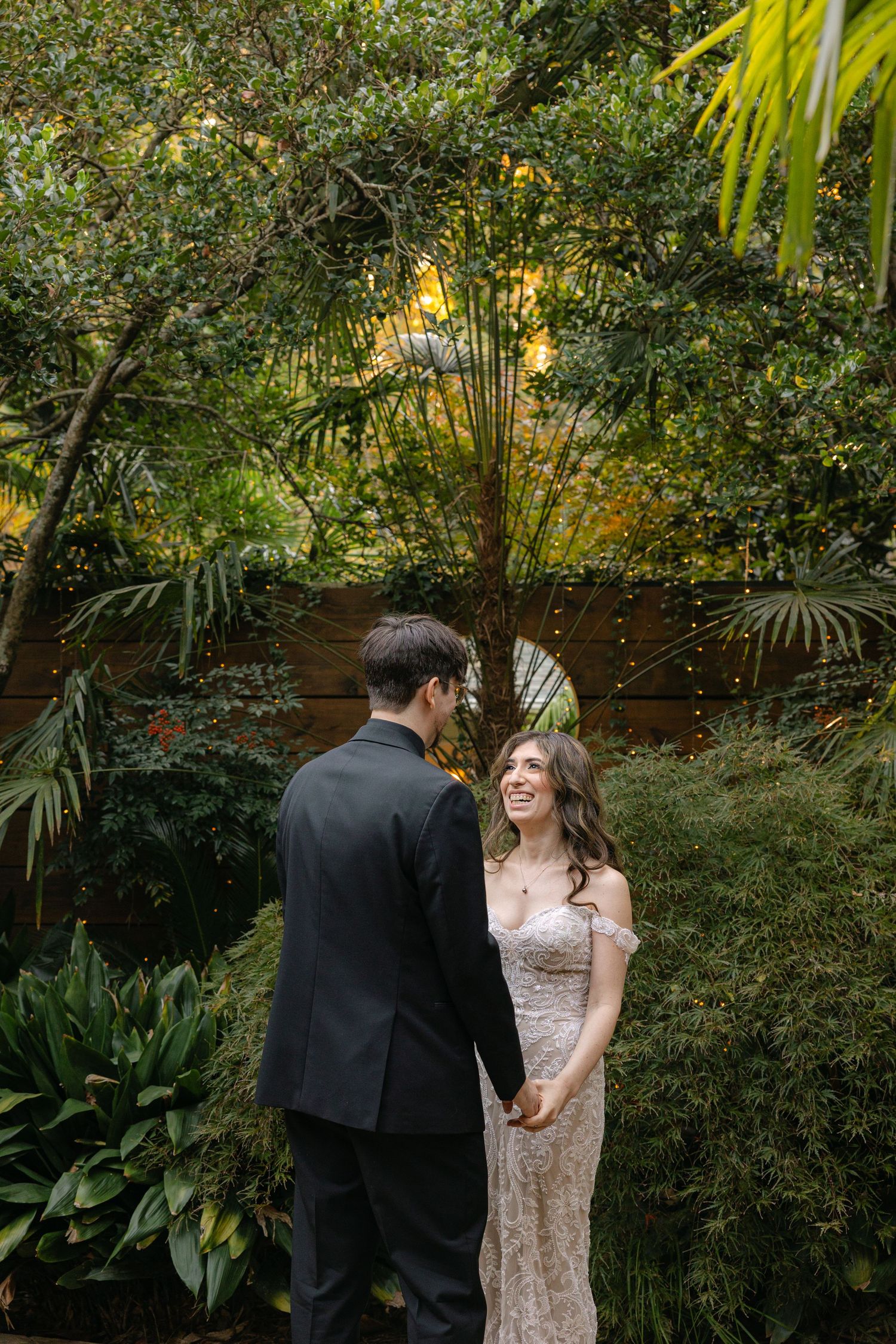 A couple shares a first look on their wedding day at The River Road and Jasmine House in South Carolina.