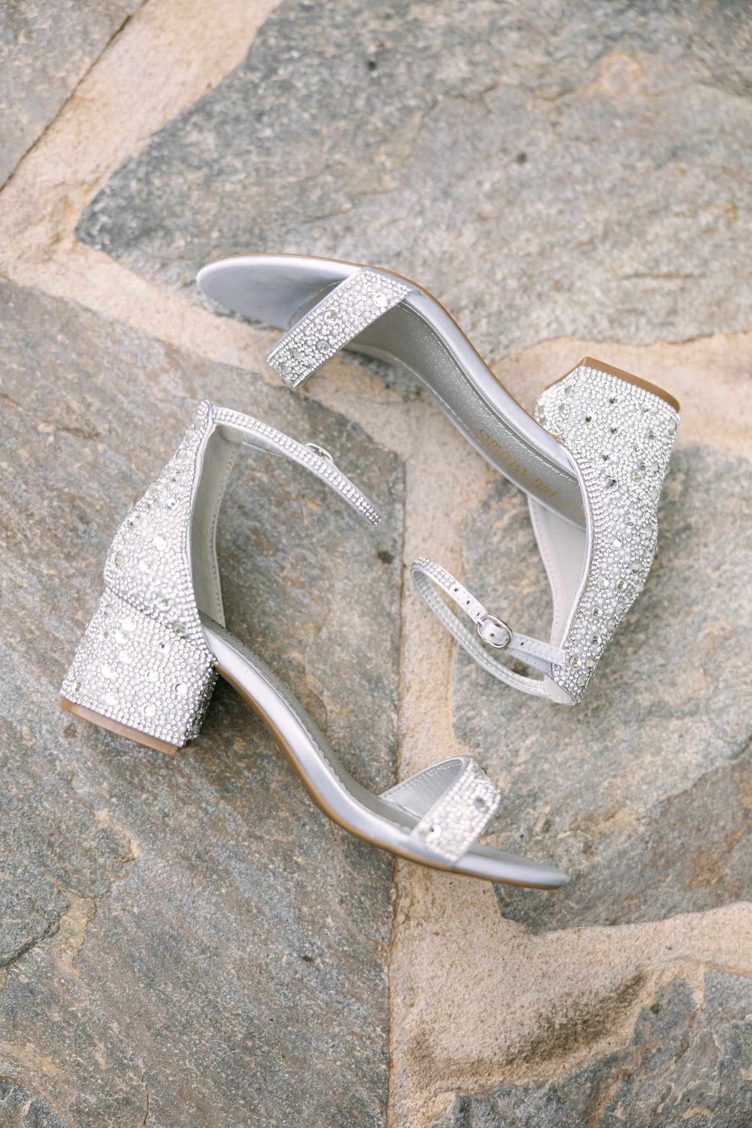 White bridal heels styled on soft neutral fabric for South Carolina wedding detail photo