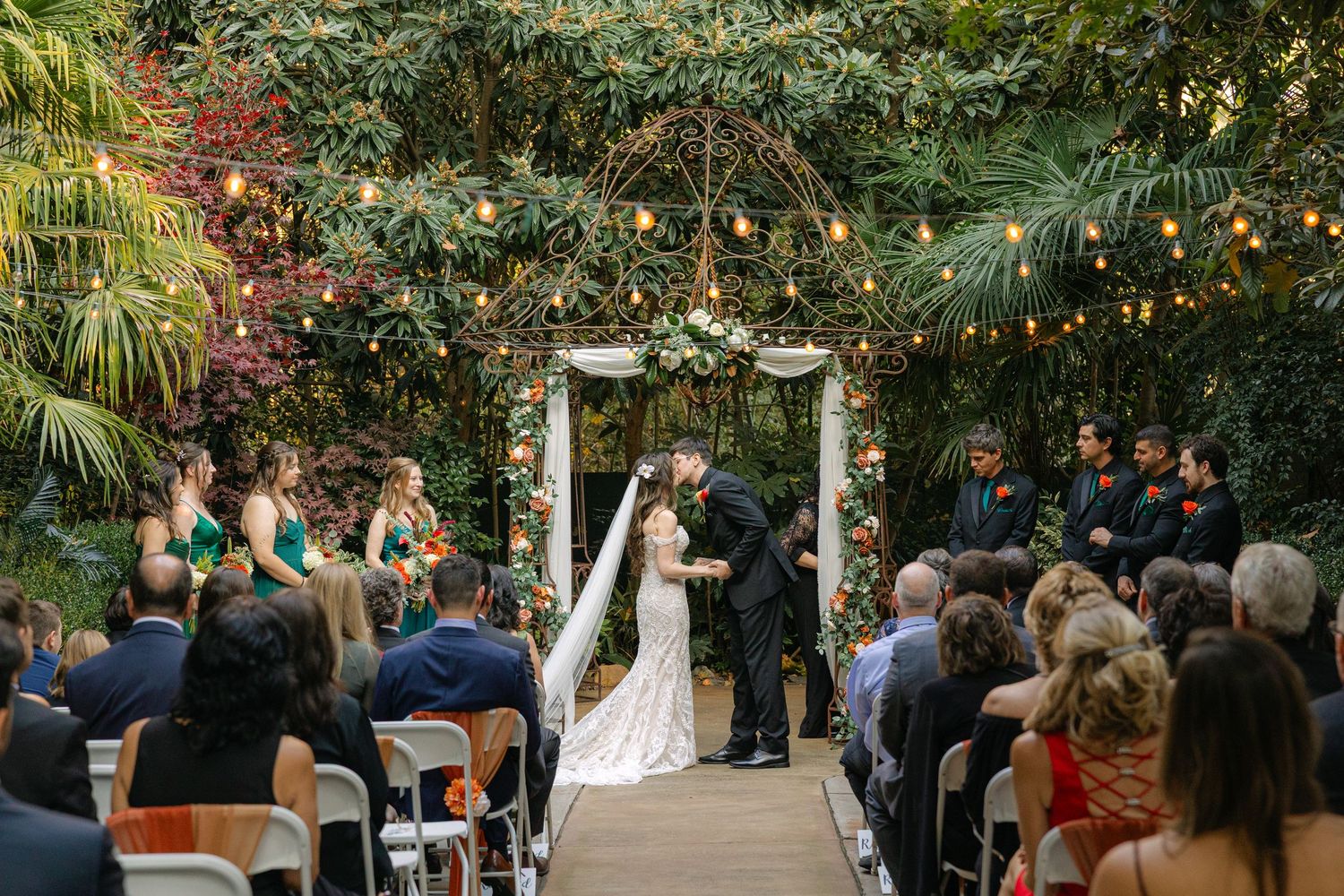 A couple shares their first kiss at the altar at River Road and Jasmine House in Columbia, South Carolina.