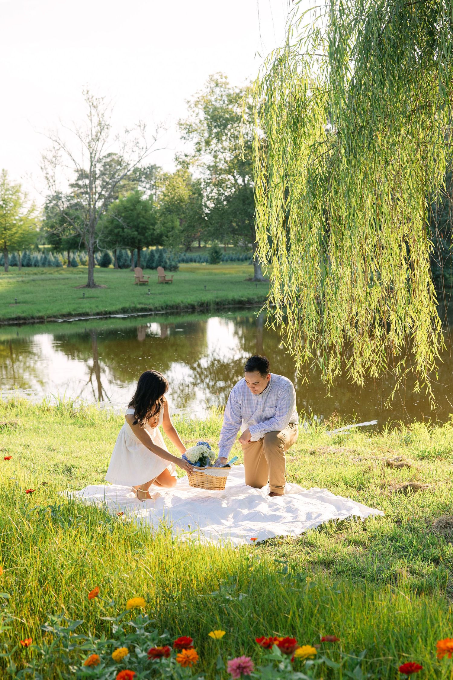Stephanie and Matt prepare a picnic basket together at Hollow Creek Tree Farm in Gilbert, SC.