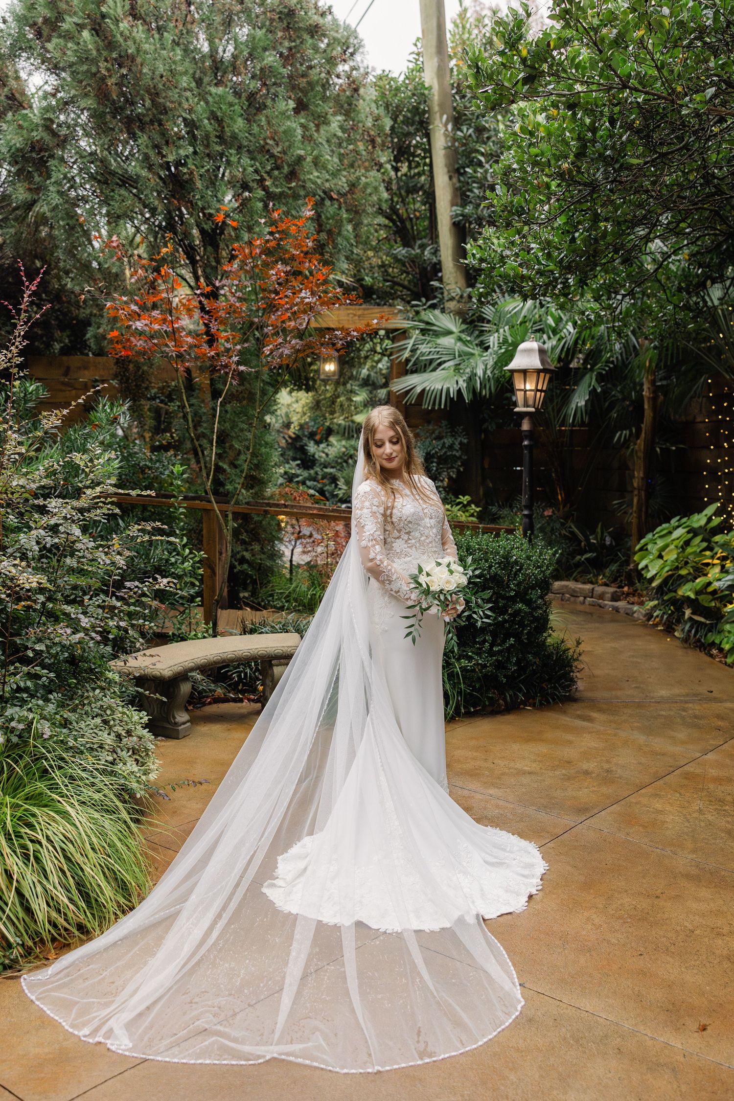A bride poses for a traditional portrait in the gardens at the River Road and Jasmine Houses in Columbia, South Carolina.