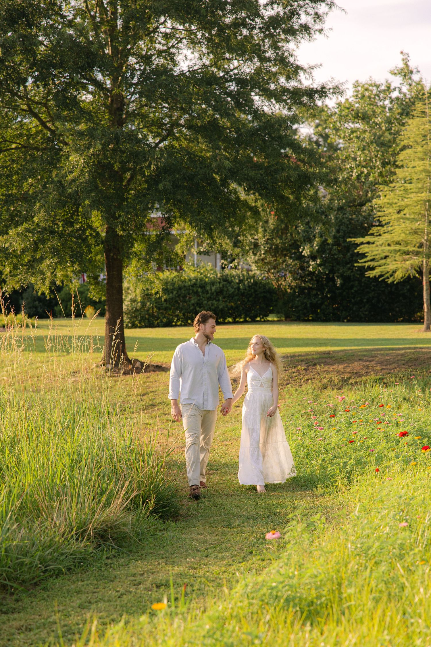 Emily and Harrison go for a walk through the flower field at Hollow Creek Tree Farm.