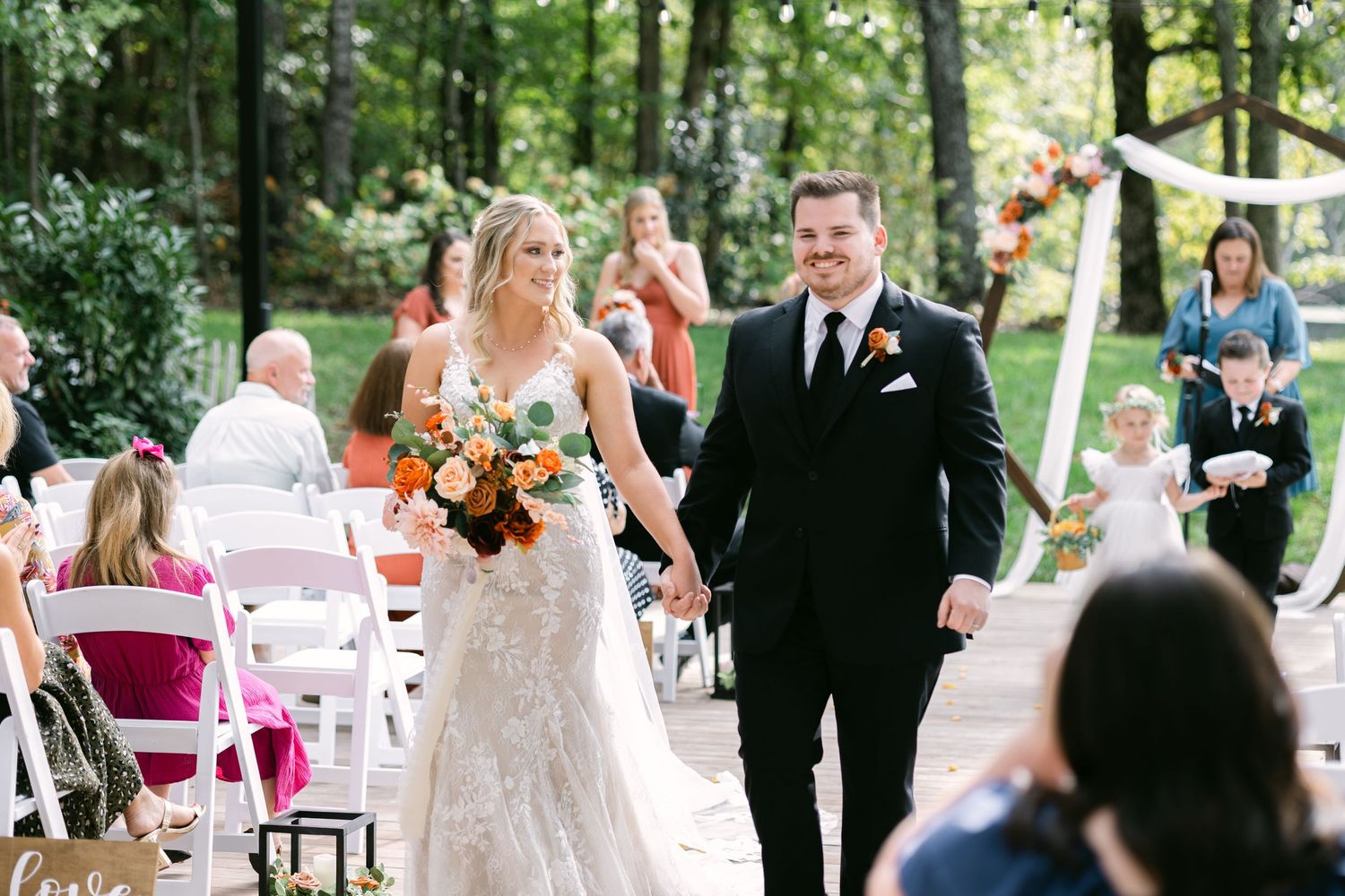 A couple walks down the aisle after their wedding ceremony at Piney Grove Ranch in South Carolina.