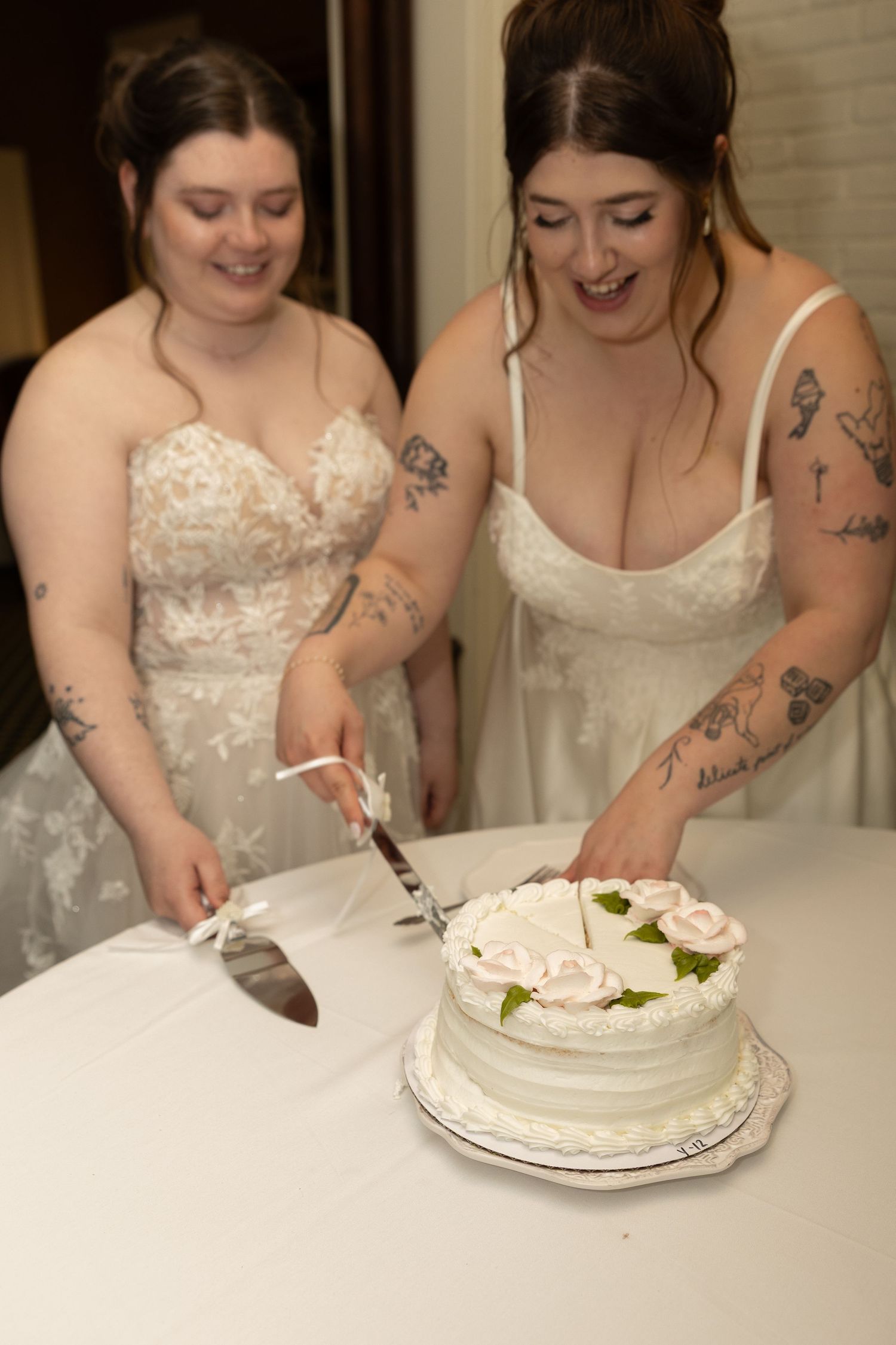 Brides smelling cutting cake