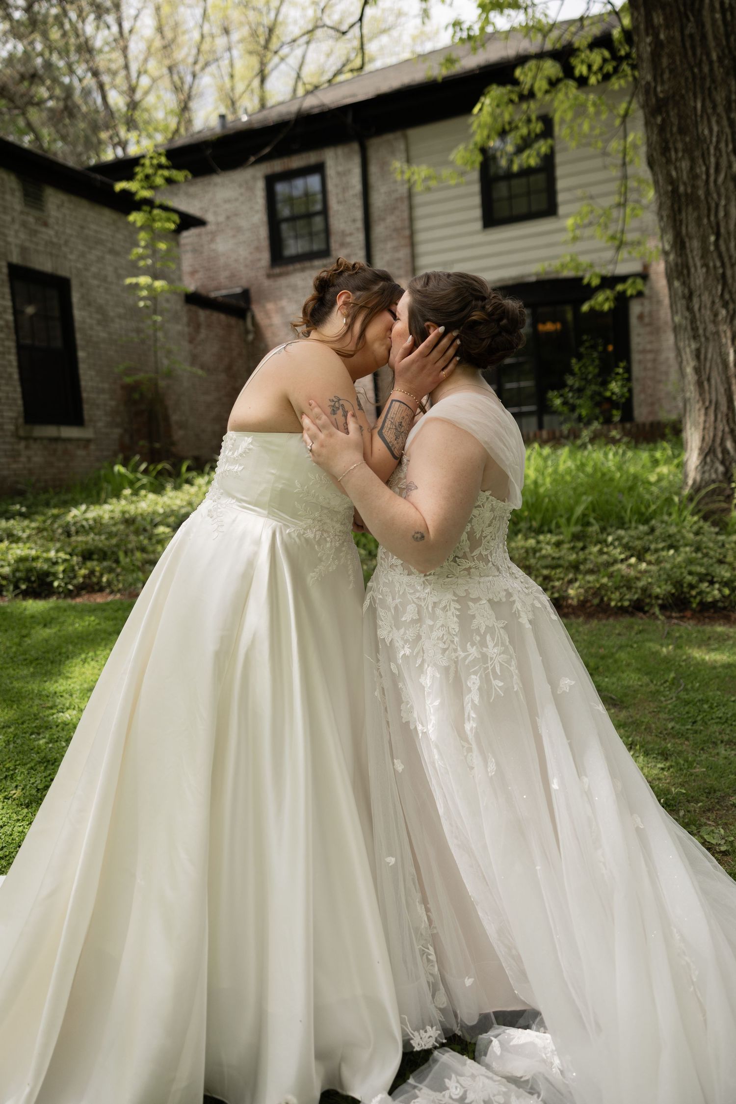 Brides during their first look kissing
